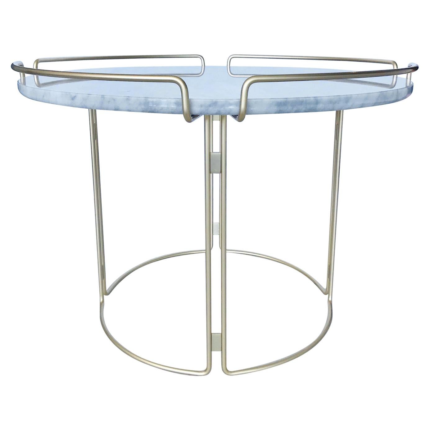 Gorgeous side table designed by Fabrice Berrux for Roche Bobois. Table has a Mid-Century Modern inspired design. Features white Carrara marble top with round three-sided steel wire frame in lacquered matte gold or satin brass finish.