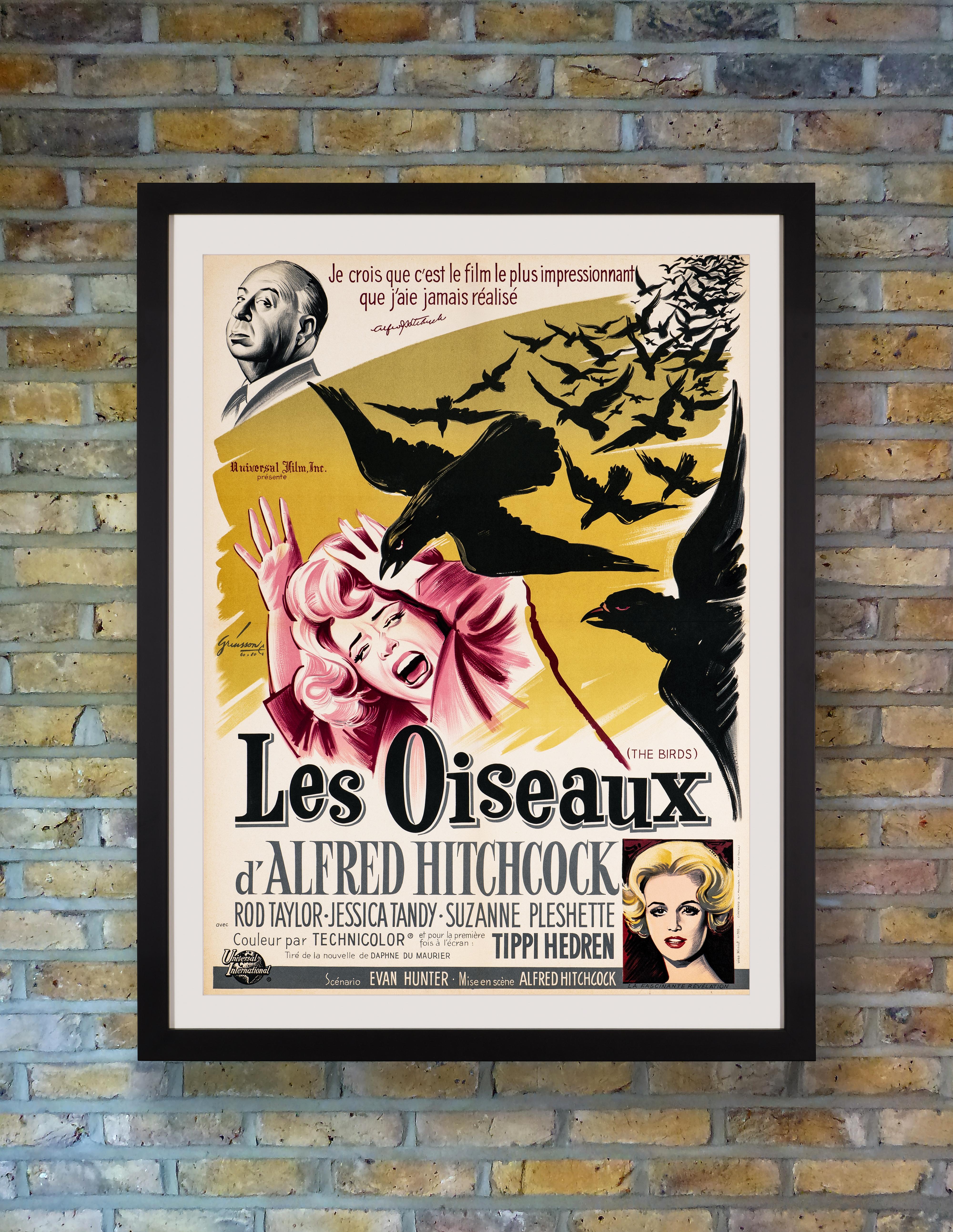A spooky French Moyenne poster by prolific French poster artist Boris Grinsson for Alfred Hitchcock's 1963 psychological masterpiece 'The Birds,' based on Daphne du Maurier's 1952 short story of the same name, starring Tippi Hendren in her debut