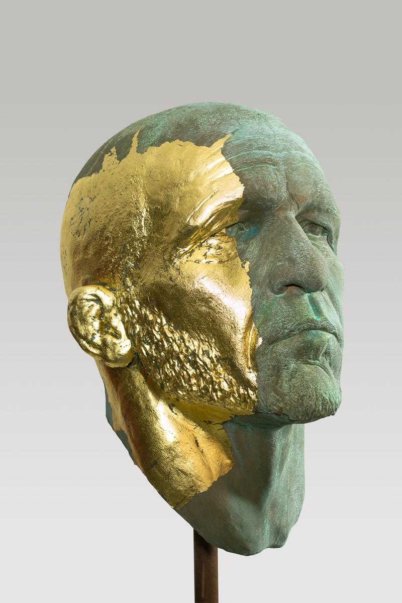 This extraordinary sculptural portrait head takes its beginnings from classical antiquity. Attention to detail and complete understanding of the human figure are evident. Kugler adds a modern twist to this classical style by using a splatter of gold