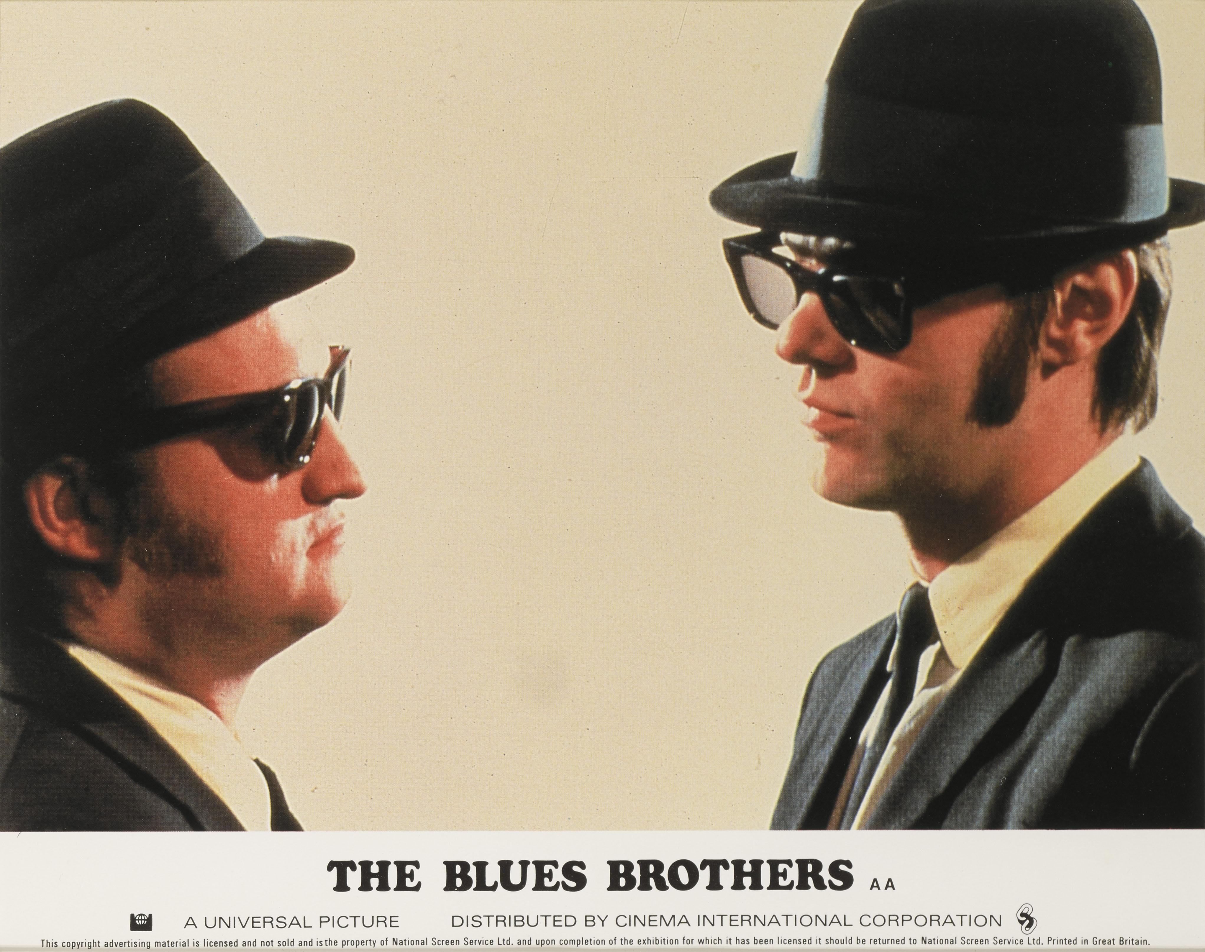 Original British front of house still used by the studio to advertise the film inside the cinema. This piece shows John Belushi, Dan Akroyd playing Jake and Elwood Blues in this cult Classic directed by John Landis.
This piece is framed in a Sapele