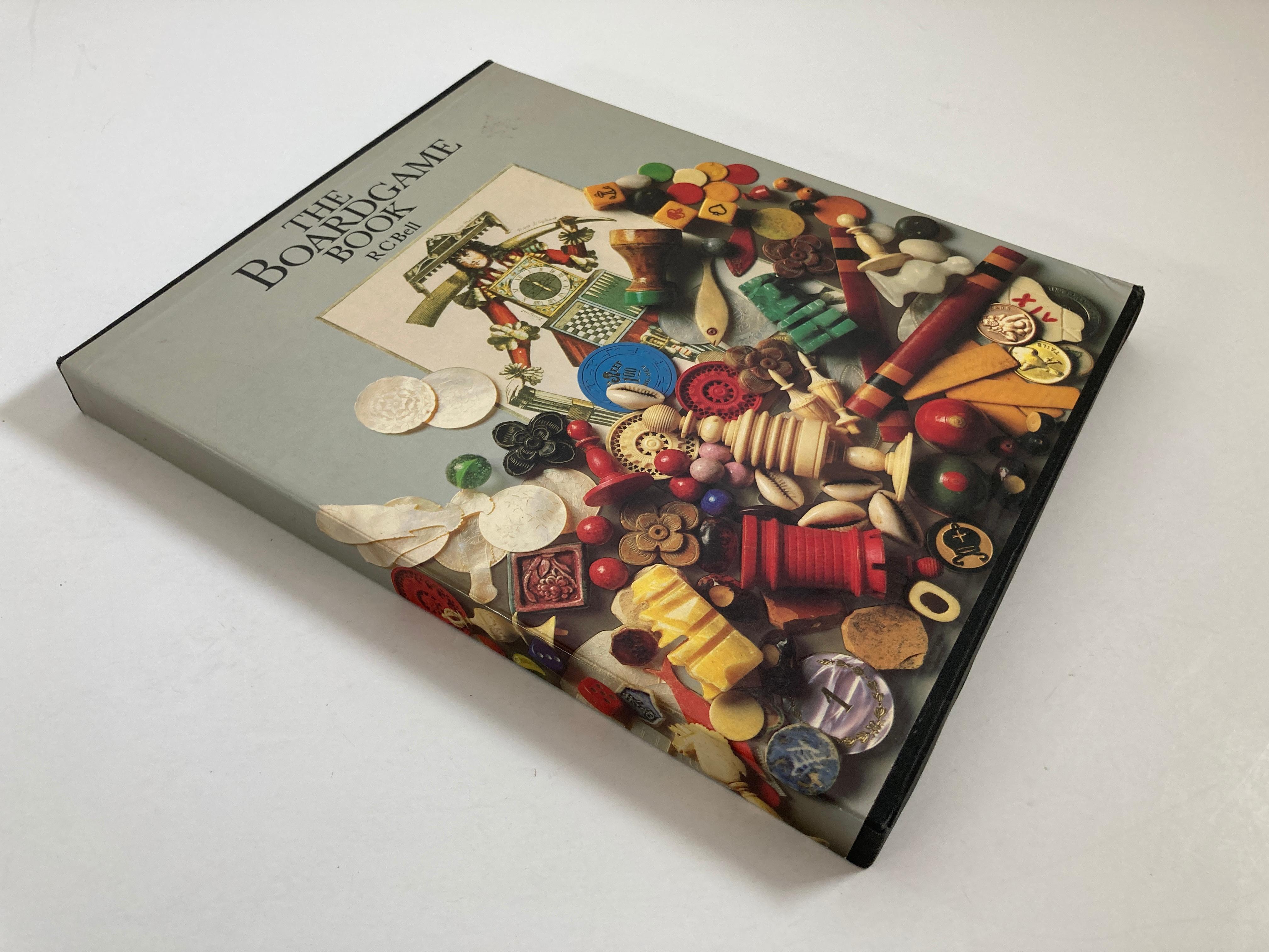 The Board Game Book, Bell, R.C. Hardcover Book in sleeve,
Published by London: Marshall Cavendish, 1979.
Large 1st edition in publisher black cloth boards with gilt title to spine, patterned endpapers. 
This is a superb compendium of the world's