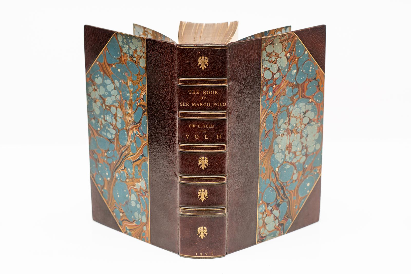 2 Volumes. Sir Henry Yule. The Book Of Ser Marco Polo. With Maps and Illustrations. Bound in 3/4 brown morocco by Zaehnsdorf, marbled boards, top edges gilt, raised bands, gilt on spines, marbled endpapers. Published: London:
John Murray 1903
H: 9