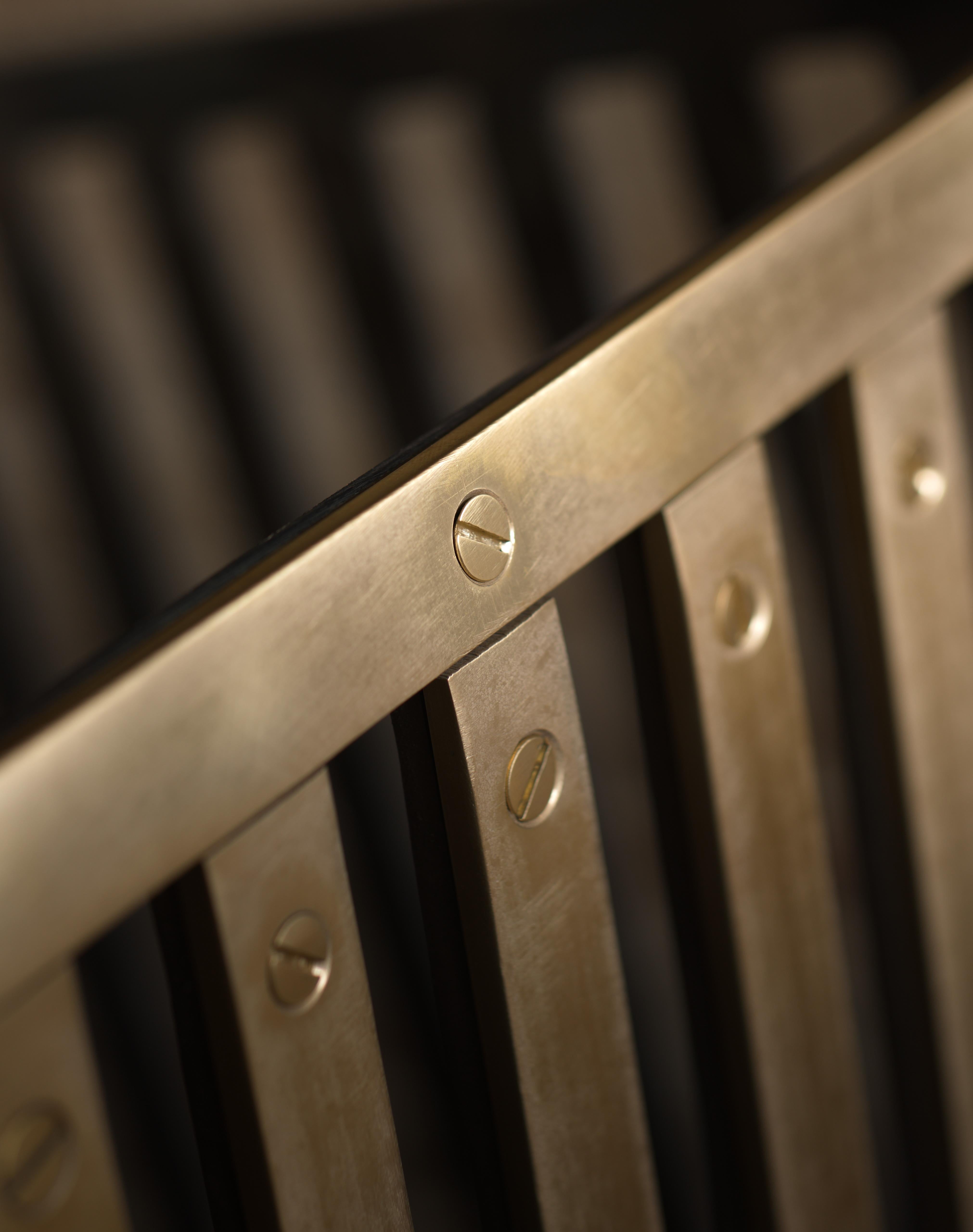 The brass and steel Grate - Untreated solid steel and brass
B.B. - At first I wanted to align all the slotted screws until I realized that there is beauty in chaos. A simple design made sophisticated by the addition of brass.
Specifications: