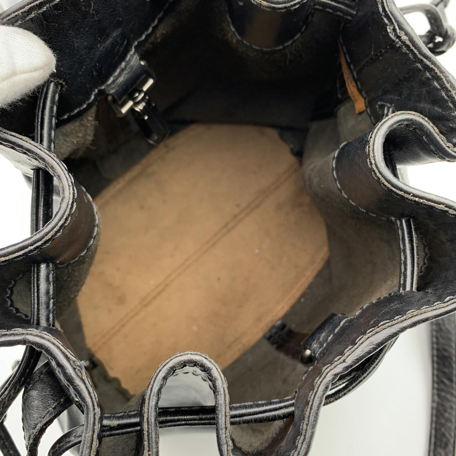The Bridge Black Leather Drawstring Bucket Shoulder Bag. Silver metal signed hardware. Drawstring closure on top. Adjustable shoulder strap.Suede lining. 'The Bridge' tag inside


Details

MATERIAL: Leather

COLOR: Black

MODEL: -

GENDER: