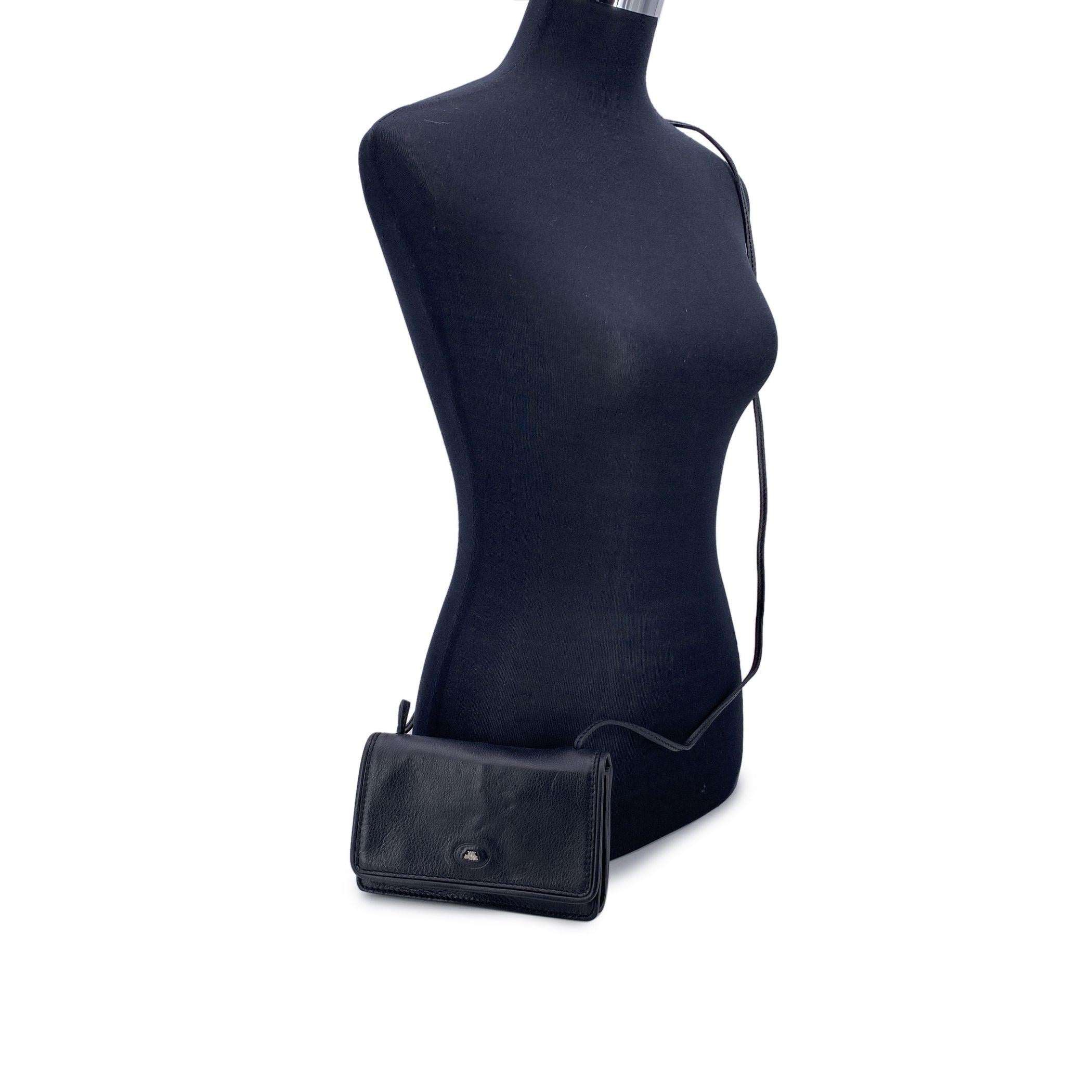 Discover the understated elegance of The Bridge Black Leather Small Crossbody Bag, a chic accessory that combines classic design with practical functionality. This compact piece is perfect for those who appreciate timeless style, featuring a sleek