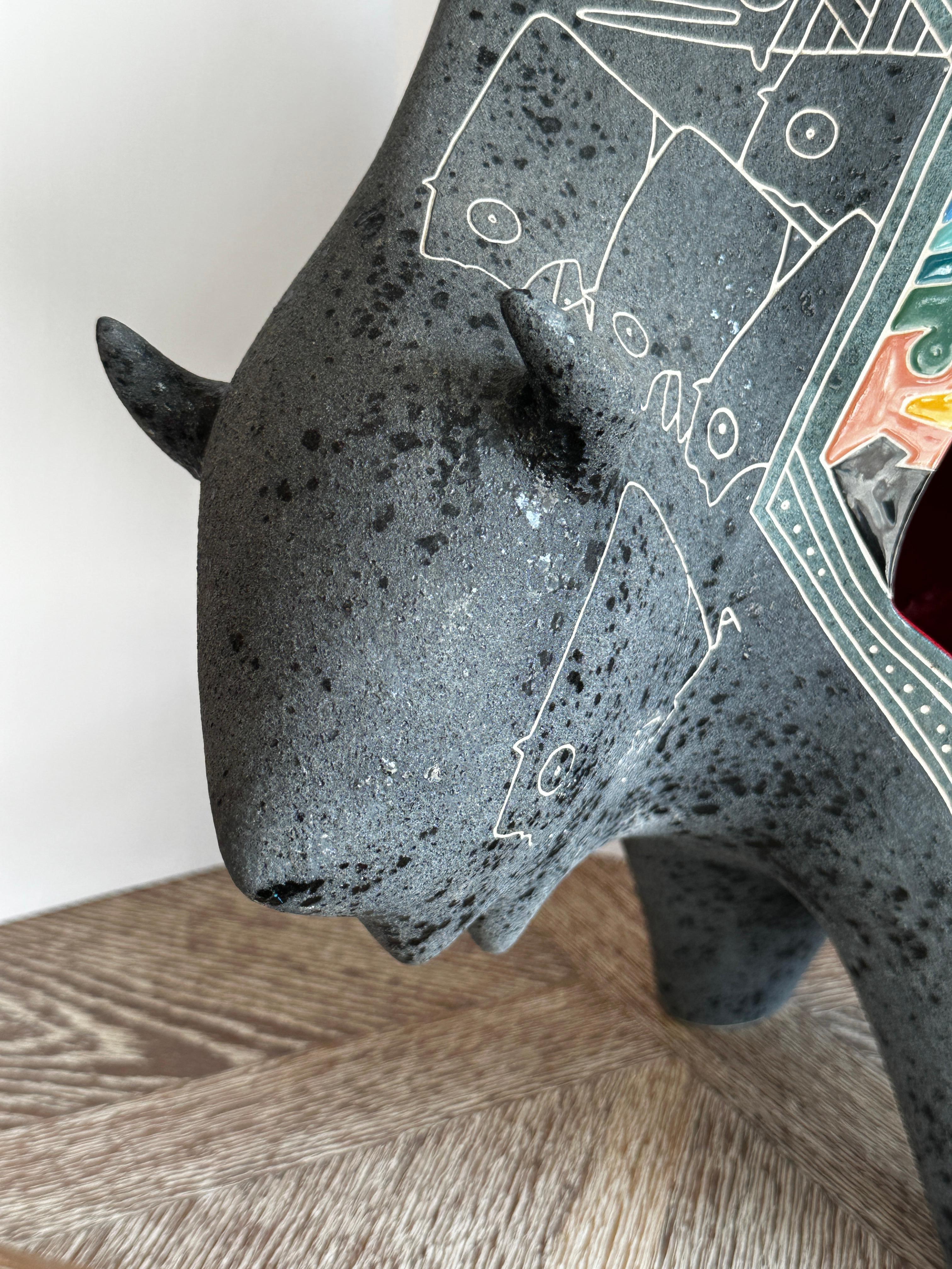 This piece by Gene and Rebecca Tobey is a stunning Black Buffalo ceramic sculpture. In Native American cultures, the buffalo stands for the sacredness of life. Often associated with the earth and the natural world, the animal is viewed as a powerful