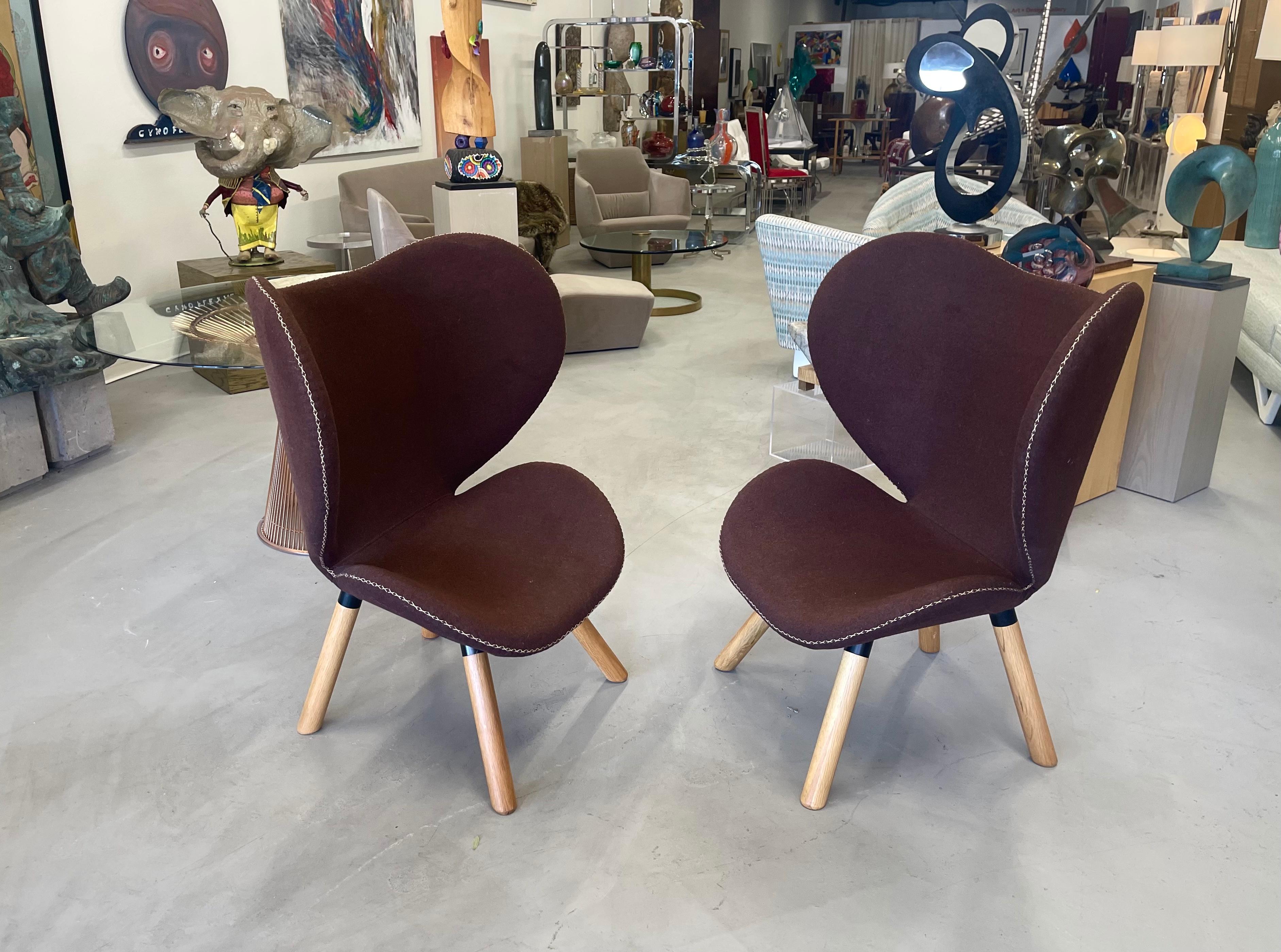 Pretty pair of chairs designed believed to be designed by Marianne Bjorlav, these ButterFly chairs were retailed by the Danish Design Store and have a label underneath. In a chocolate brown felt with great contrasting edge stitching detail. The legs