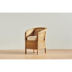 The Cane Reflection Chair in Wood by Malawi Cane