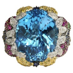 Ring aus 14 Karat Weißgold mit blauem Topas im Schachbrettschliff und mehreren Edelsteinen und Diamanten