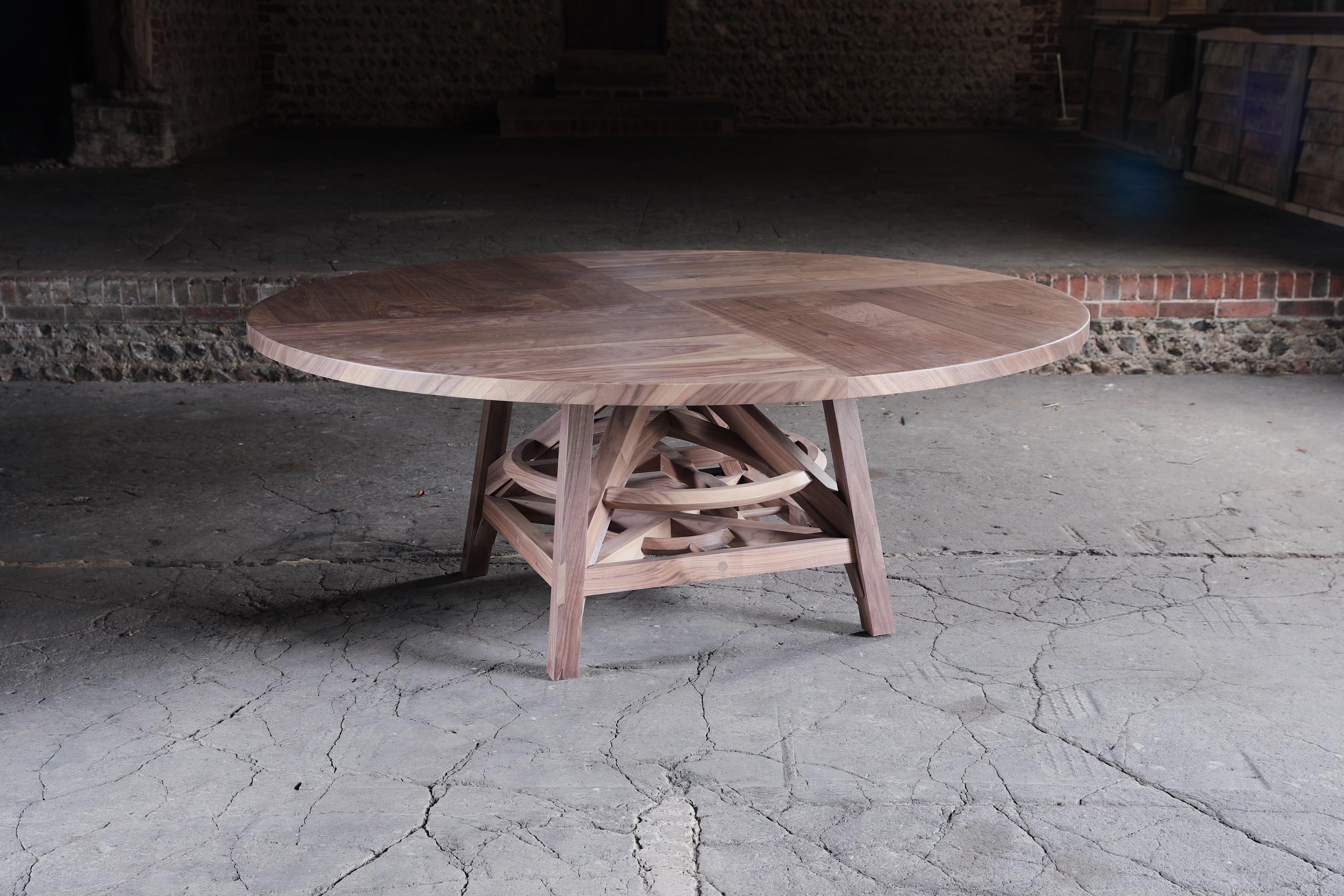 Unnecessarily over engineered, honouring skills lost from the past. Hand made from solid walnut. We have put every woodworking problem into this piece. In other words this table was deliberately built the hardest way possible to test our skills.