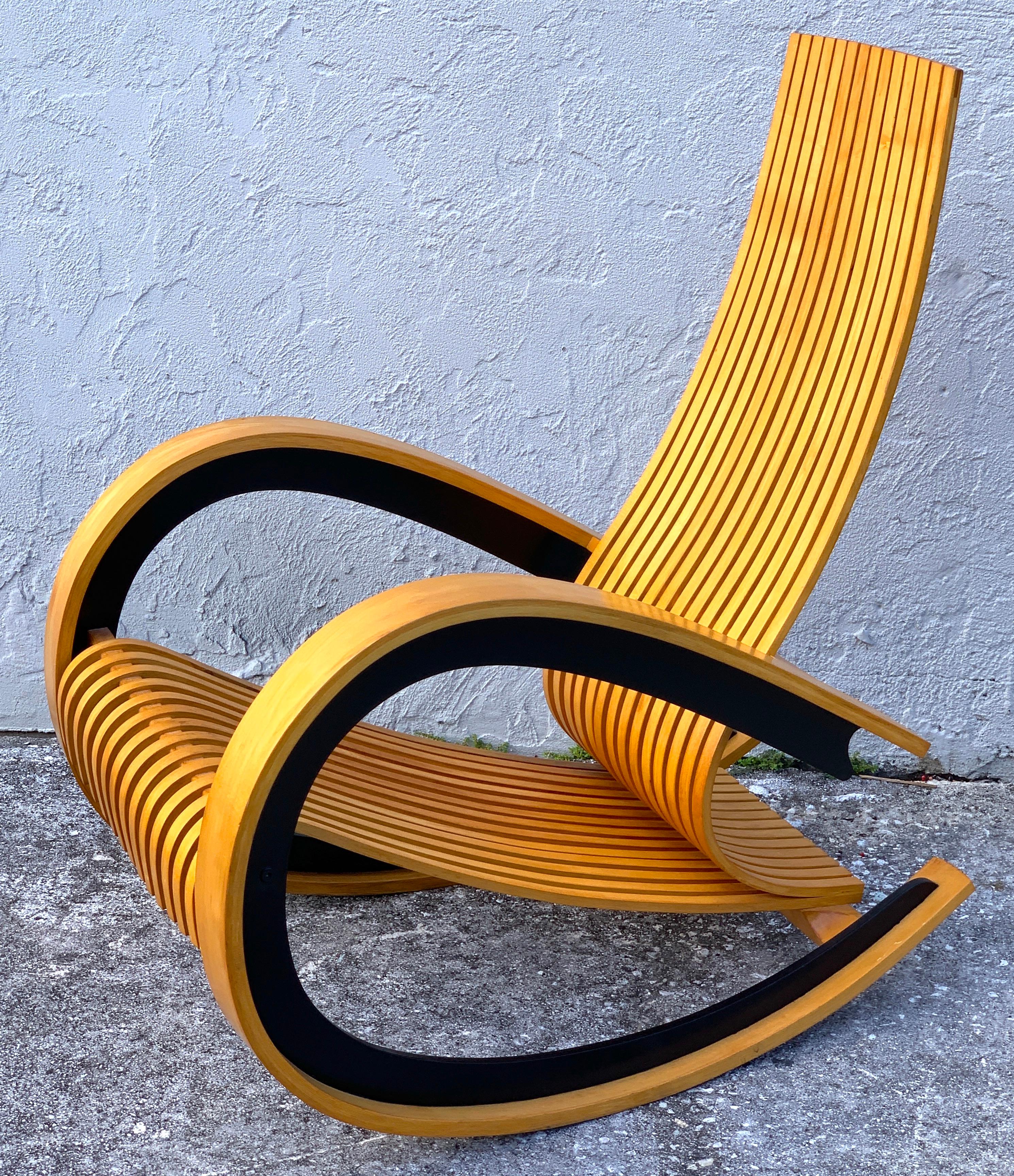 The Cato rocker/ rocking chair, by Tony Portus, circa 1990
Bent and ebonized maple, Award winning British design, sculptural beauty & comfort.
Measures: Seat height is 16.5