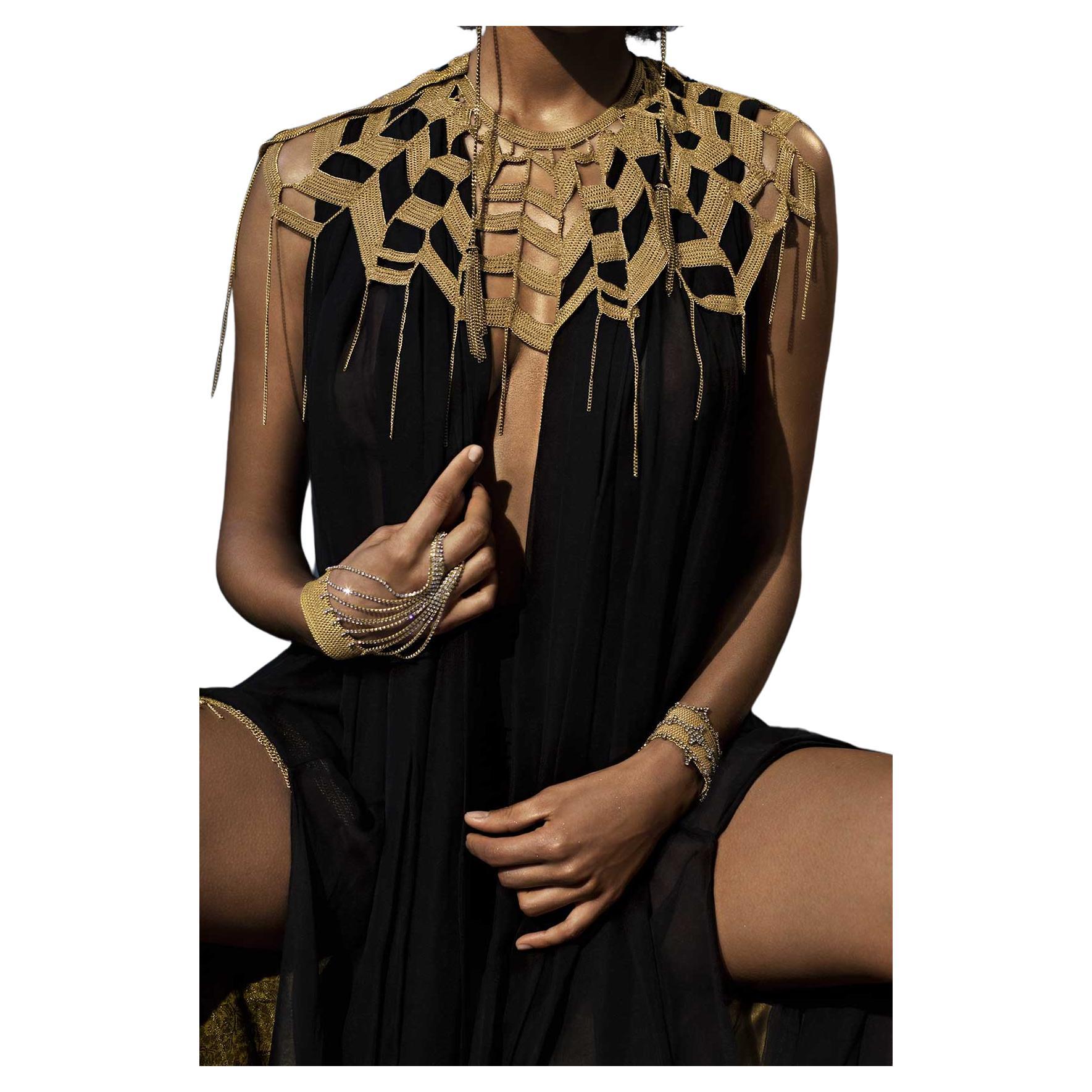 The Chain Lace Cape is hand-sewn with patented technique and the result is a new genre in fashion, a hybrid between clothing and jewellery. We like to call it 