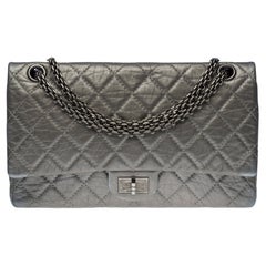 The Chanel 2.55 Classique double flap handbag inquilted leather with metallic si