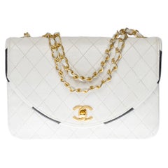 The Chanel Classic Shoulder bag in white 
black quilted leather with GHW