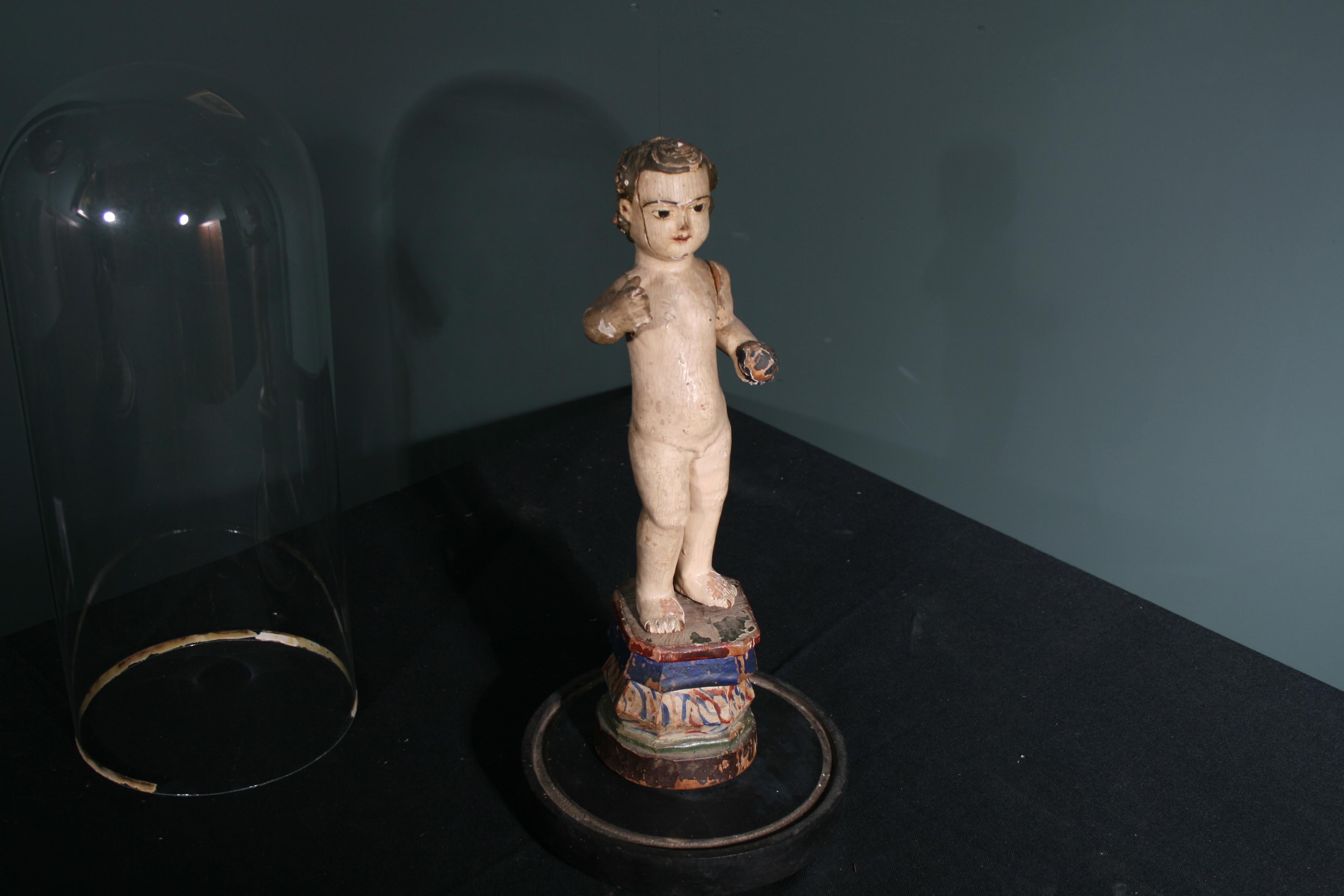 Polychrome Carving of the Christ Child holding the Orb.  Very rare carving (probably in Limewood).  Totally original paint and condition throughout.

The glass globe is later in date c.1800s and just for display (not included in price).

Southern