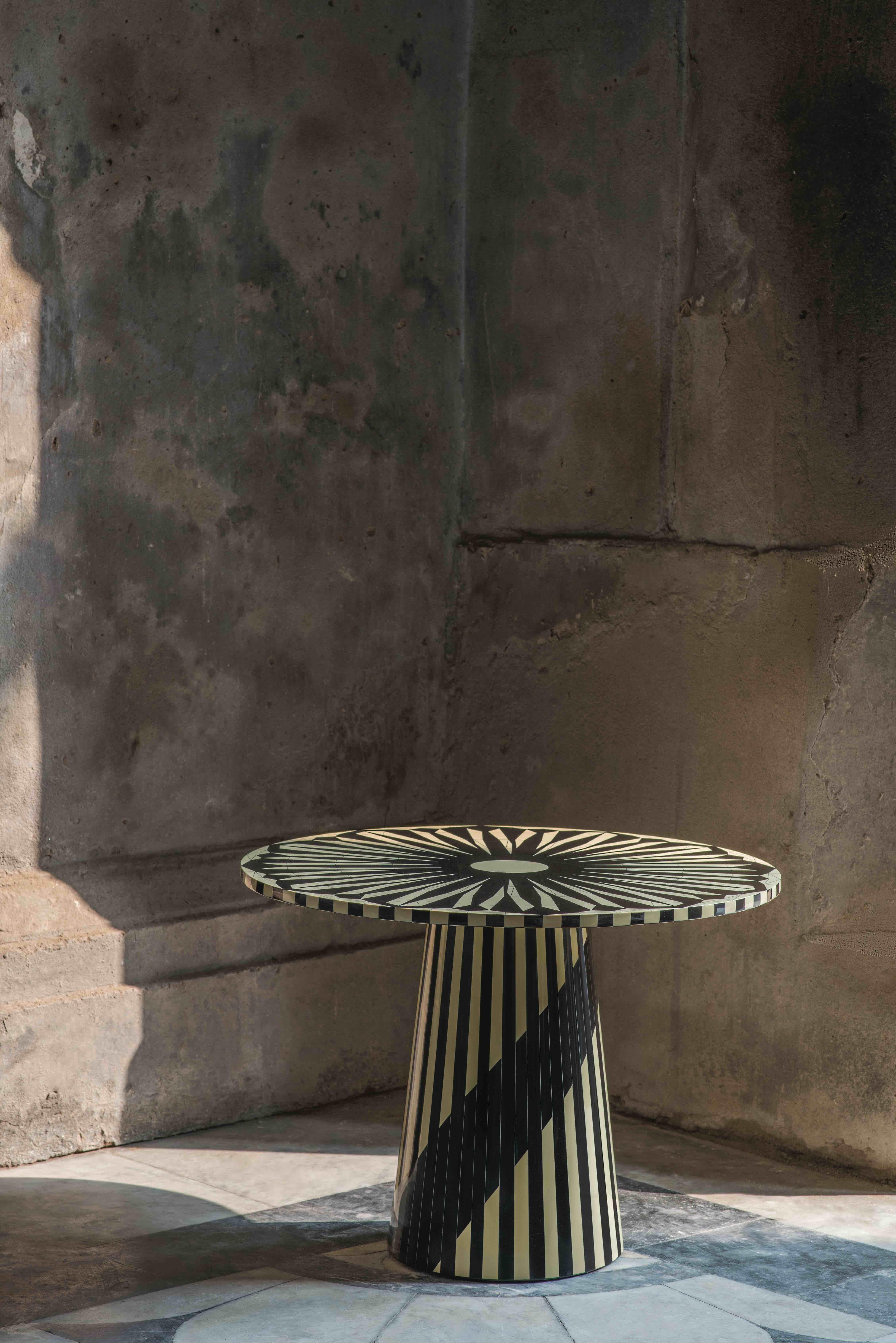 The Circus Black and White Side Table by Matteo Cibic is a gorgeous versatile small round table.

India's handicrafts are as multifarious as its cultures, and as rich as its history. The art of bone and horn inlay is omnipresent here. Artisans from