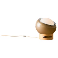 The Clan table lamp by Harvey Guzzini for Meblo features a diffused, removable w