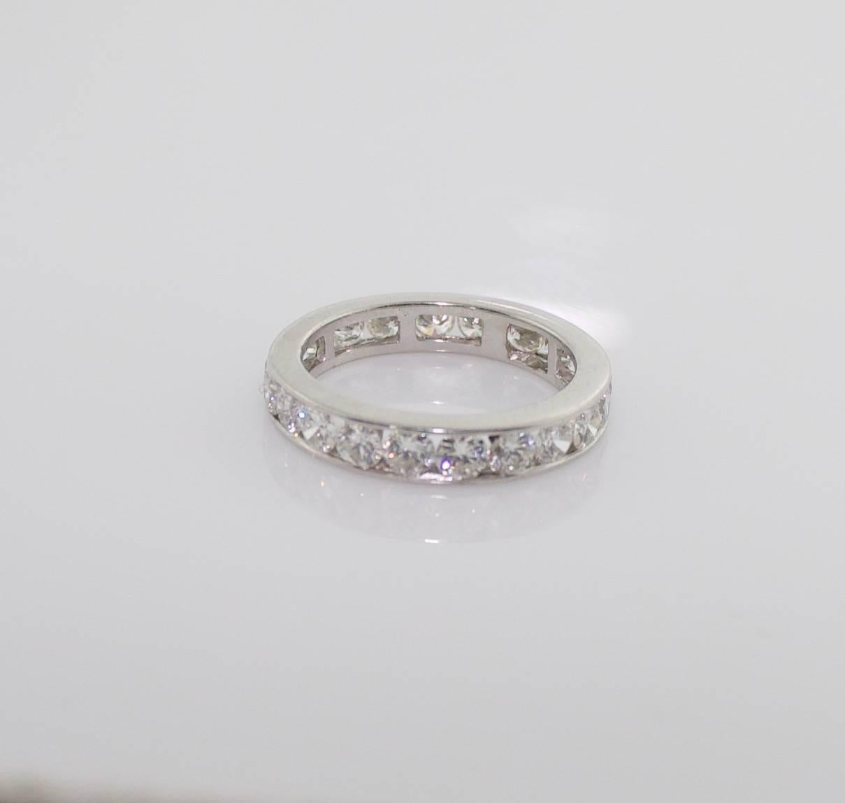 The Classic Eternity Band 18k White Gold Diamond Ring 2.70 carats size 6 1/2
Twenty Two Round Brilliant Cut Diamonds weighing 2.70 carats approximately
Really Nice Quality All Around  GH  VVS-VS2
Size 6 1/2
