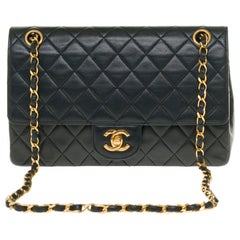 The Classy Chanel Timeless 25cm Shoulder bag in black quilted lambskin and GHW