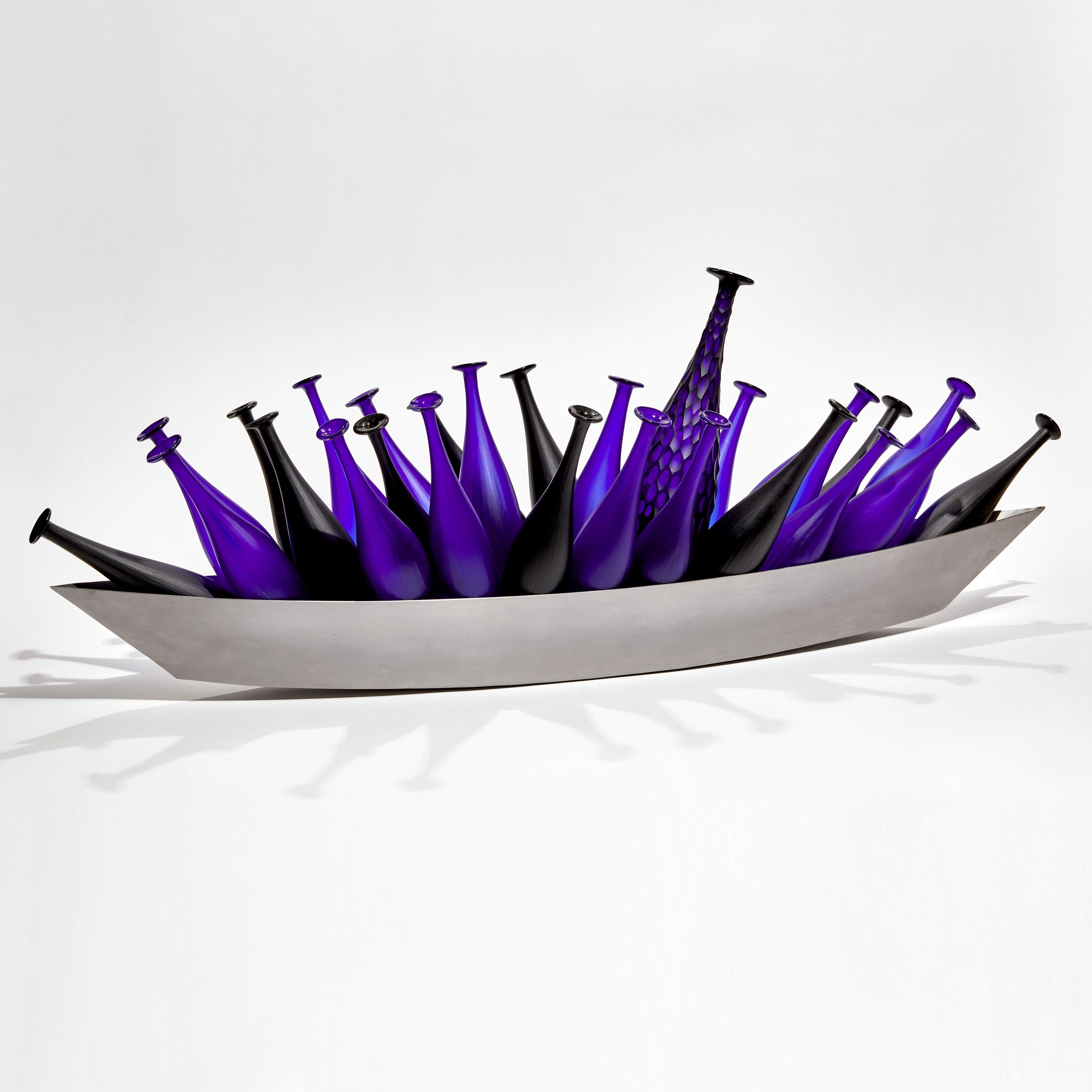 'The Cobalt Voyager' is a unique intense electric blue and black hand-blown and cut glass artwork with steel hull by the American and Swiss artists, Philip Baldwin and Monica Guggisberg.

Combining Scandinavian and Venetian glass making techniques,