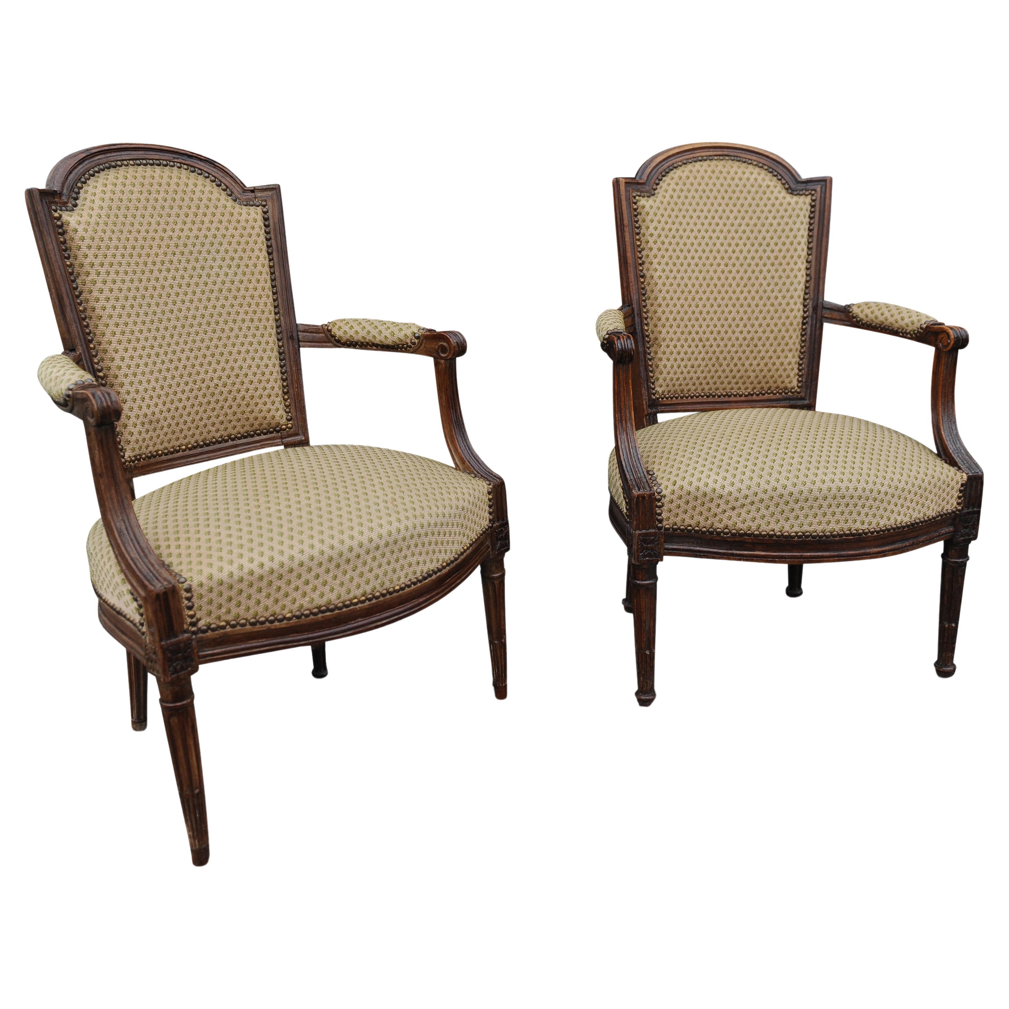 Formerly Owned By The Late Sister Of Queen Elizabeth II.The Collection of H.R.H. The Princess Margaret (1930-2002), Kensington Palace.

A Pair of Early 19th Century French Walnut Fauteuils Upholstery In Green Flower Head Needlework
