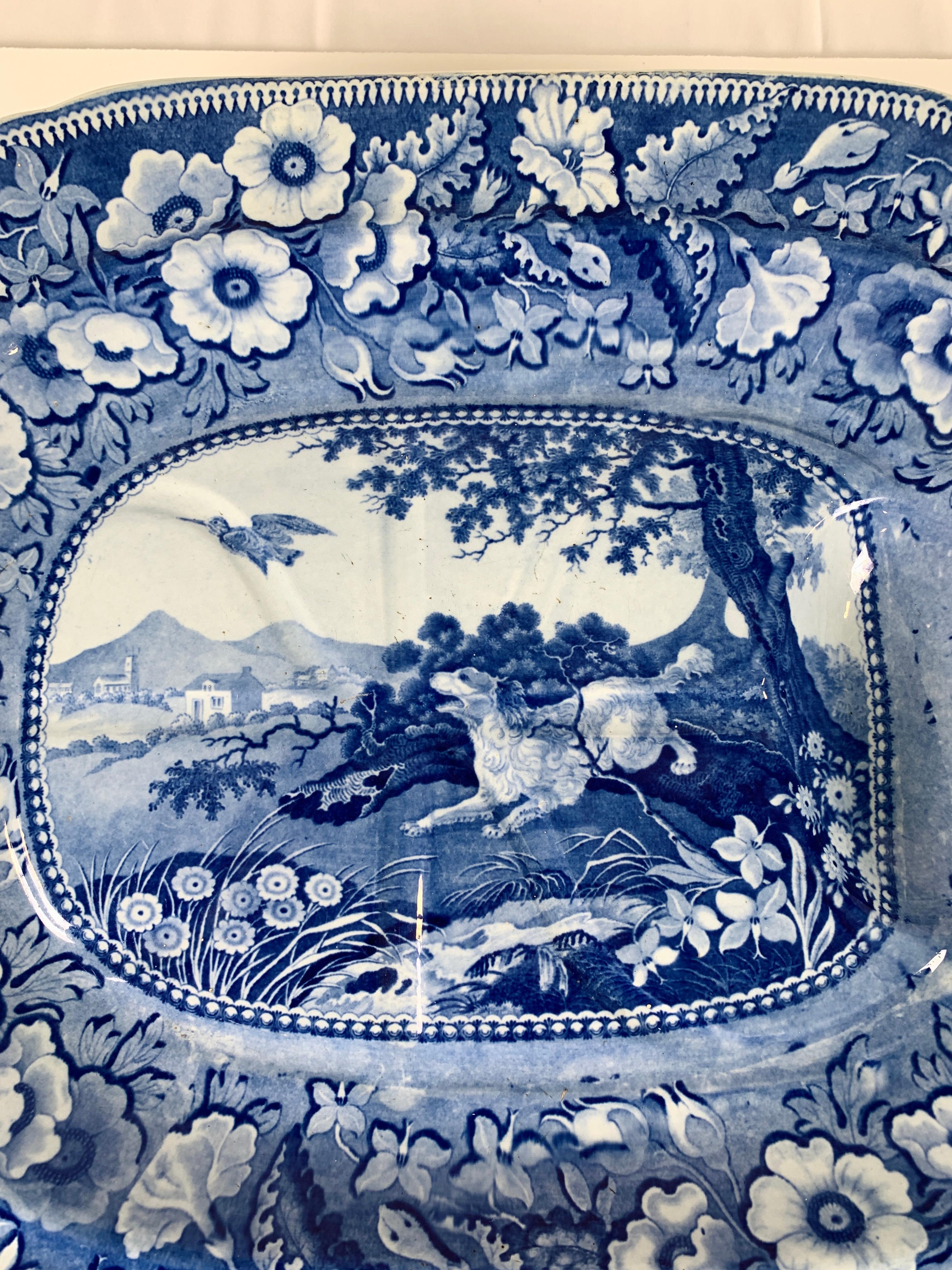Provenance: The Private Collection of Mario Buatta
Mario loved blue and white, and he loved dogs. On this platter we have both!
Made in Staffordshire circa 1830, the center of the platter shows a hound racing after a bird. Around the lively center