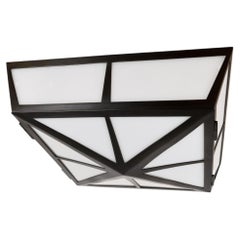 The Compass Flush Mount in Blackened Brass by David Duncan Studio