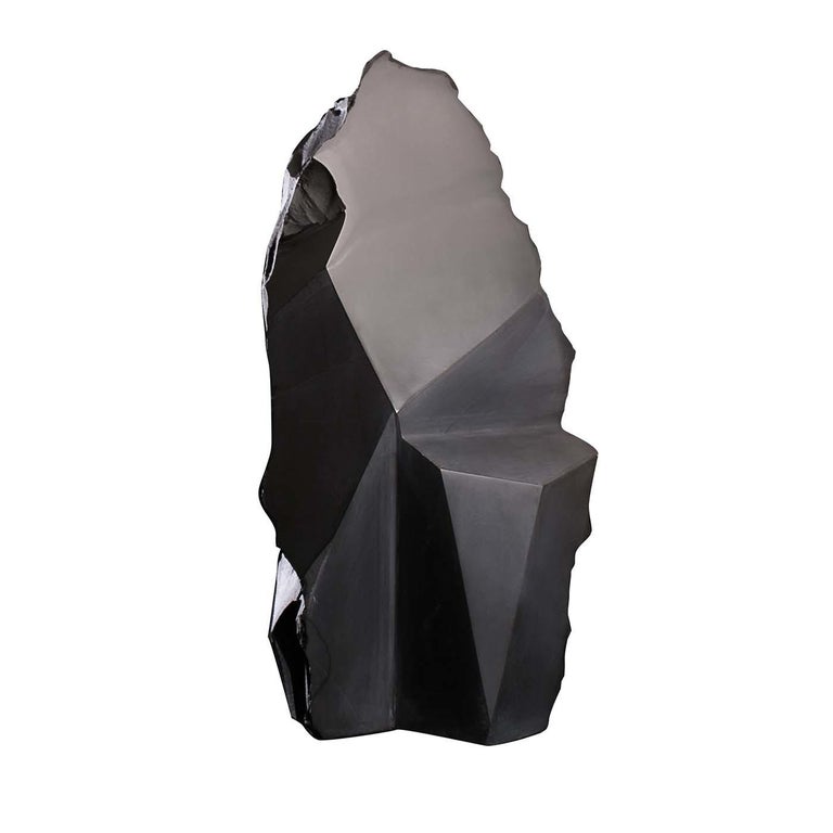 This evocative sculpture embodies Alessandra Serina's personal artistic vision and continuous aesthetic research, making a statement in a modern living room or a private studio. Executed entirely by hand of black slate stone, it is a symbolic