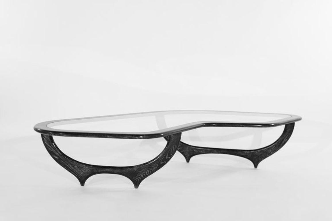 Introducing our Contour Coffee Table – a modern masterpiece inspired by the work of Iconic Italian Furniture Designers Gio Ponti, Ico Parisi, and Paolo Buffa. Handcrafted with precision from solid walnut or oak, its organic contours and glass insert
