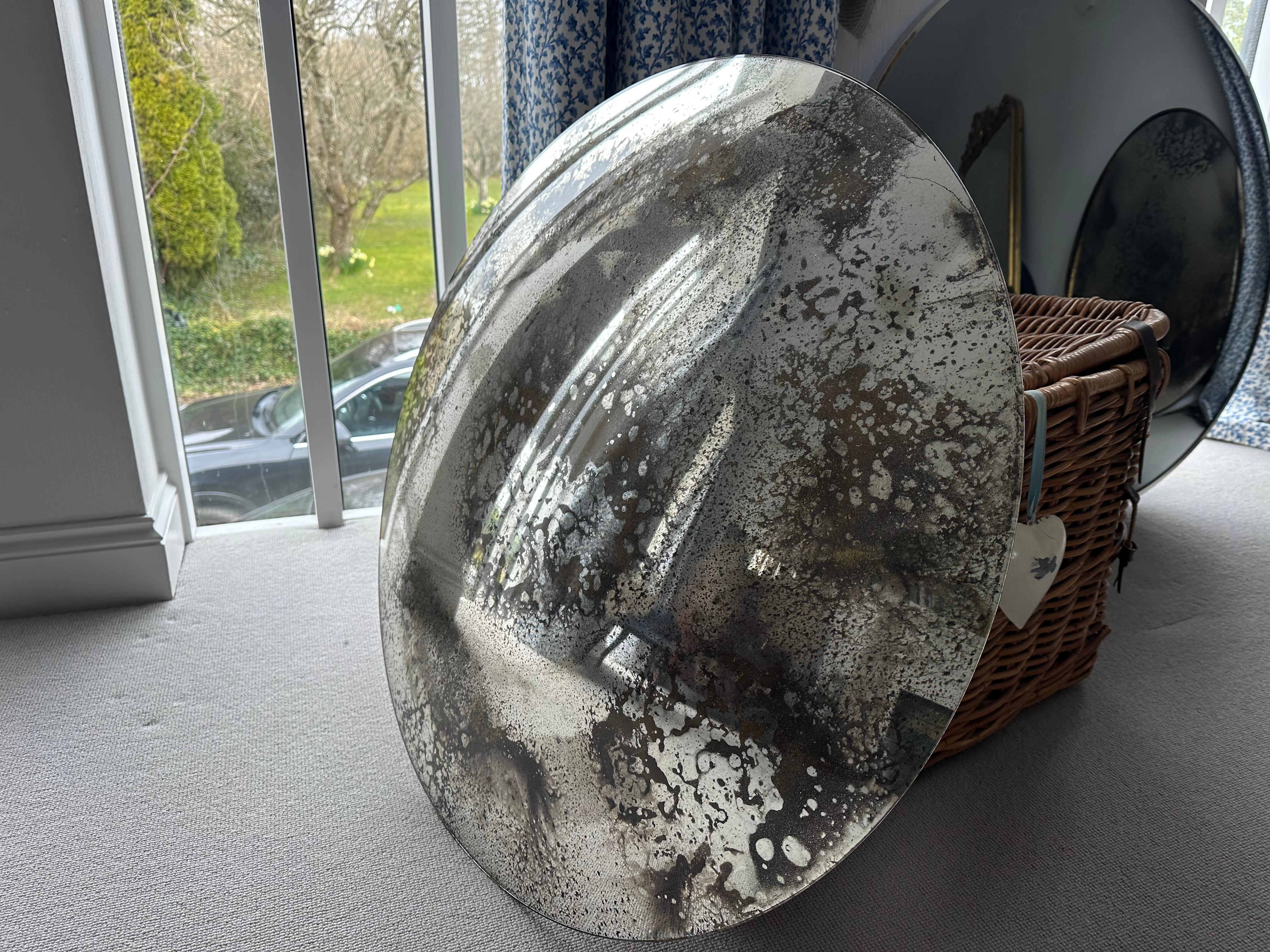 The Vernazza 80 cm silver heavily antiqued glass convex wall mirror is fabricated from 6mm low iron glass for extra clarity. Heavily antiqued with greys and warm golds.

The mirror is 80 cms in diameter and held in position with three wall clips.