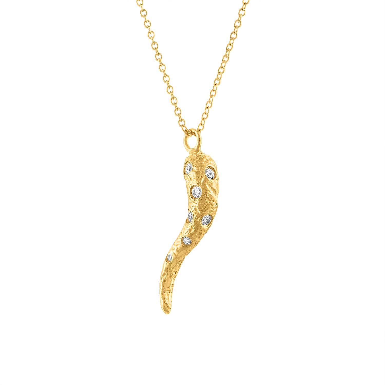 This diamond Cornicello Necklace (or Italian Horn) is a stunning piece that combines modern design with timeless elegance. The necklace features a Cornicello adorned with diamonds scattered throughout creating a look that is both eye catching and