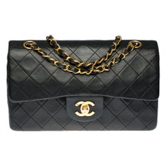 The Coveted Chanel Timeless 23cm Shoulder bag in black quilted lambskin, GHW
