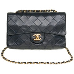 The Coveted Chanel Timeless 23cm Shoulder bag in navy blue quilted lambskin, GHW