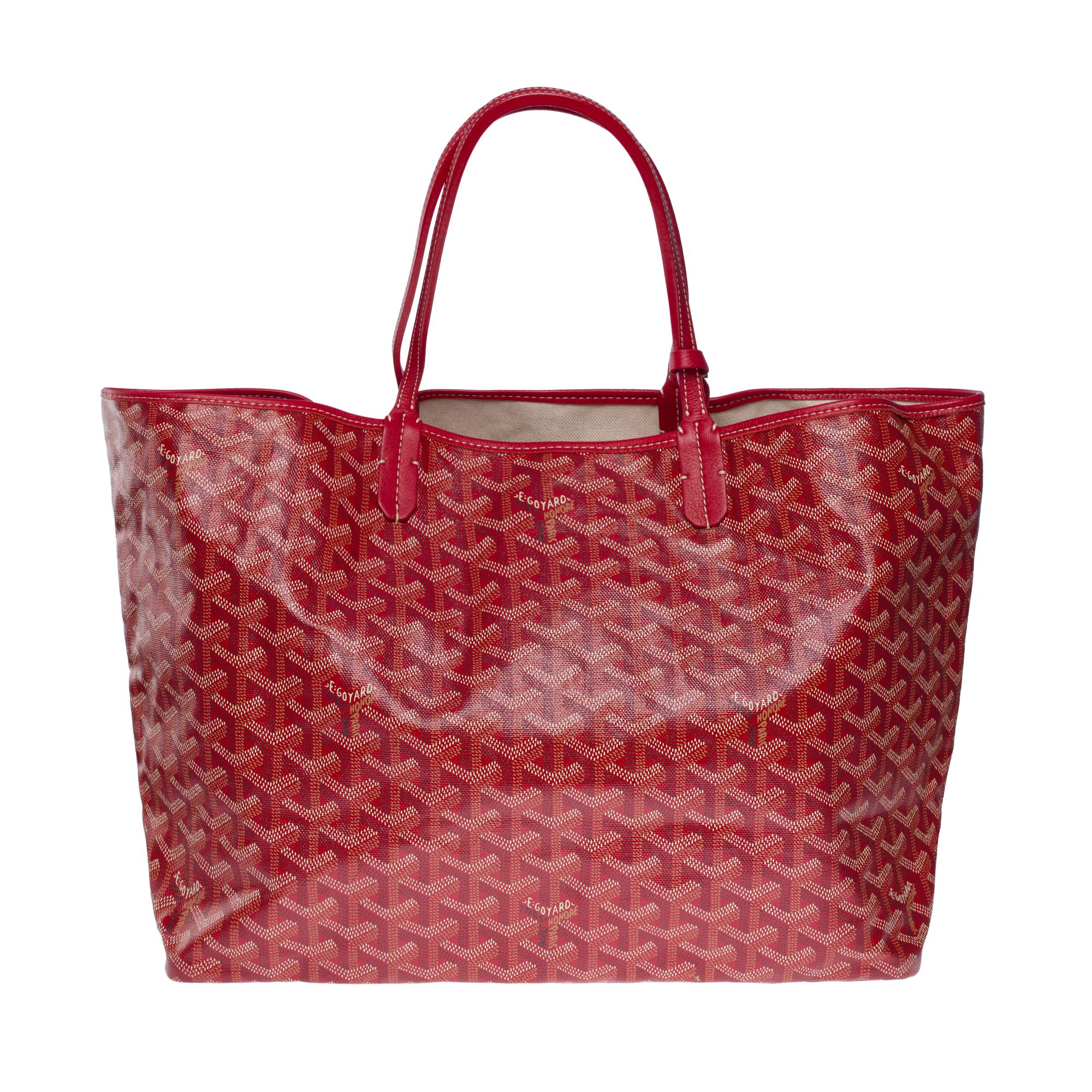 Goyard Saint-Louis PM tote bag in red Goyardine canvas, silver metal trim, double red leather handle for hand or shoulder support
Beige canvas inner lining, 1 removable matching pouch
Signature: 