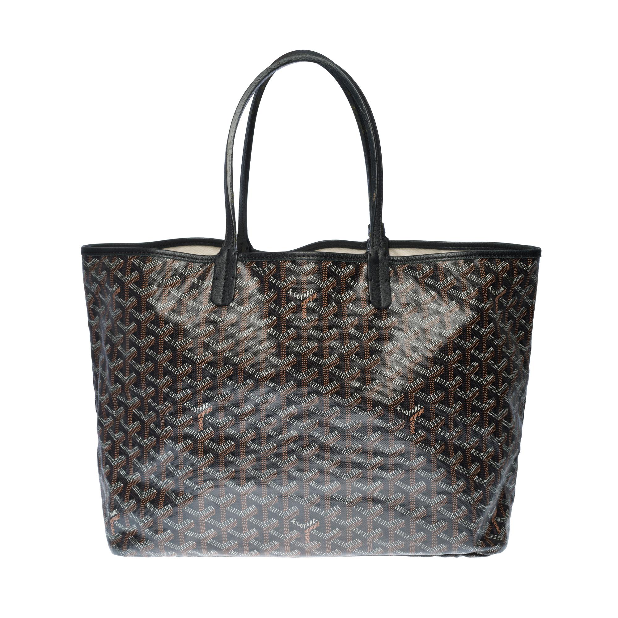 The iconic Goyard Saint-Louis Tote bag in black Goyardine canvas and black leather, silver metal hardware, double handle in black leather allowing a hand or shoulder support.

Lining in white canvas, 1 removable pouch.
Signature: 