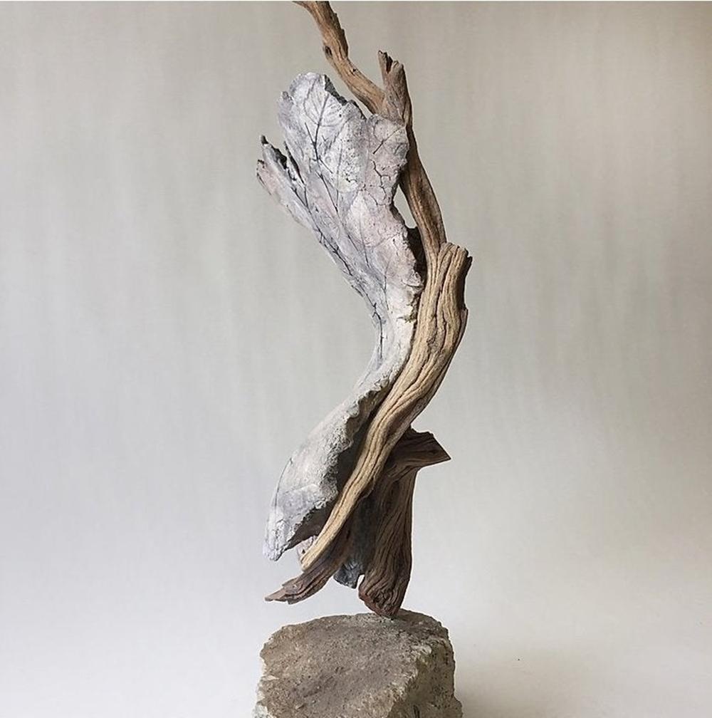 2017 Hard Wisdom series
Ceramic clay, found wood, concrete, India ink, underglaze, birch leaves, raw pigments

Measurements:
26.5 high x 14 wide x 11.5 inches deep

Hard Wisdom which has her reflecting, as she ages, on her experiences of
