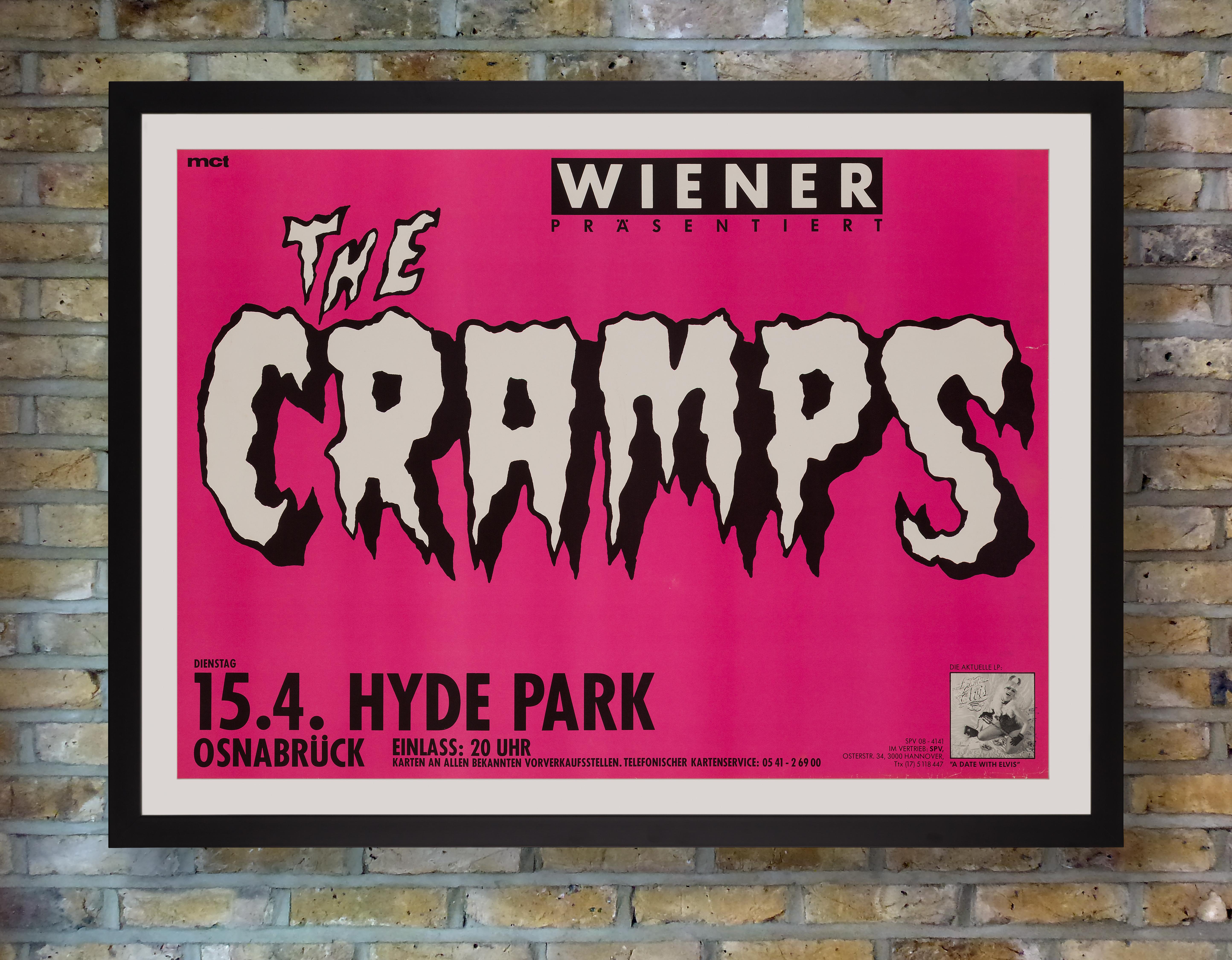 A vibrant pink poster for a performance by American garage punk band The Cramps at Hyde Park, Osnabrück, Germany on 15 April 1986 in support of their third studio album 'A Date With Elvis.' Part of the CBGB punk rock scene in New York, The Cramps