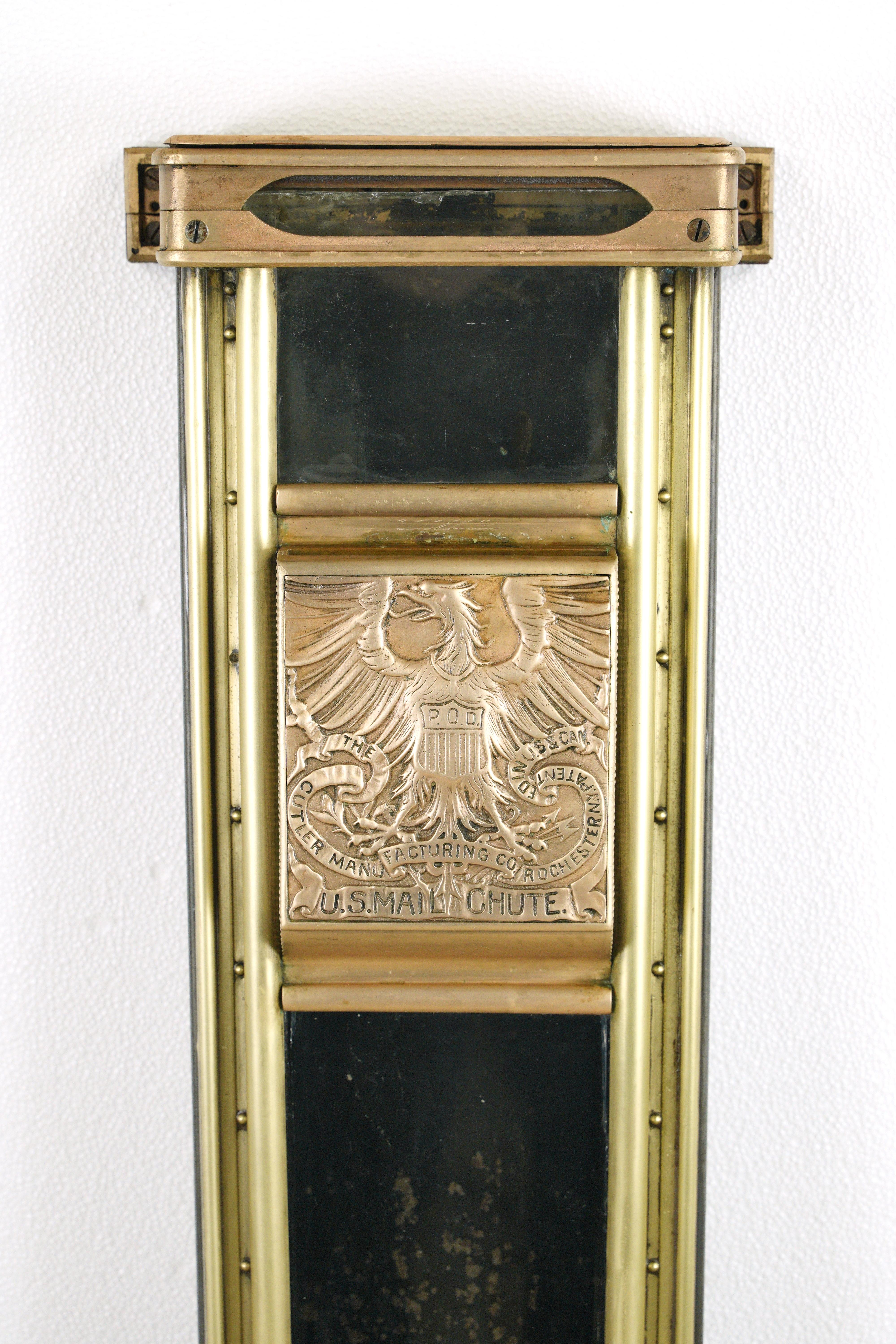 Antique brass and steel mail chute made by The Culter Manufacturing Co. Good condition with minor scratches, rusting, and missing some rivets. One available. Please note, this item is located in one of our NYC locations.