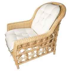 The Dana Wicker Scoop Chair by Creel and Gow