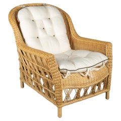 The Dana Wicker Scoop Chair by Creel and Gow