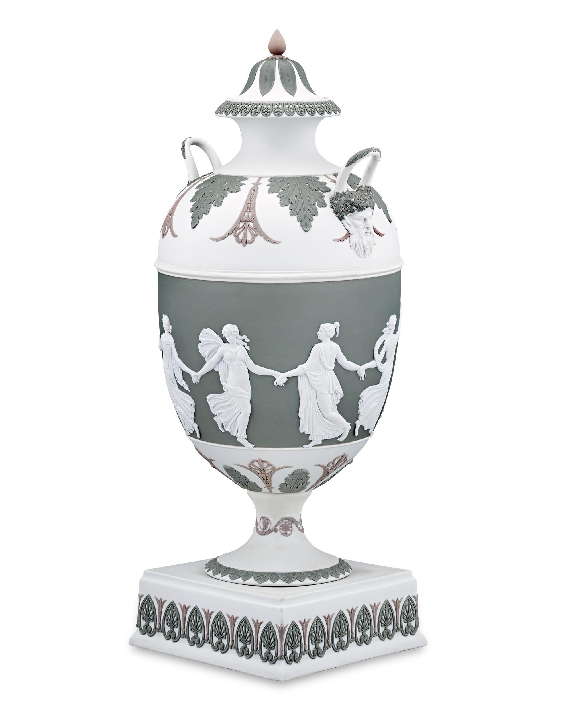 This impressive tricolor jasperware vase from Wedgwood was designed by celebrated English sculptor, illustrator and designer John Flaxman, Jr. who was considered a leading artist of the Neoclassical style in England. The design is both striking and