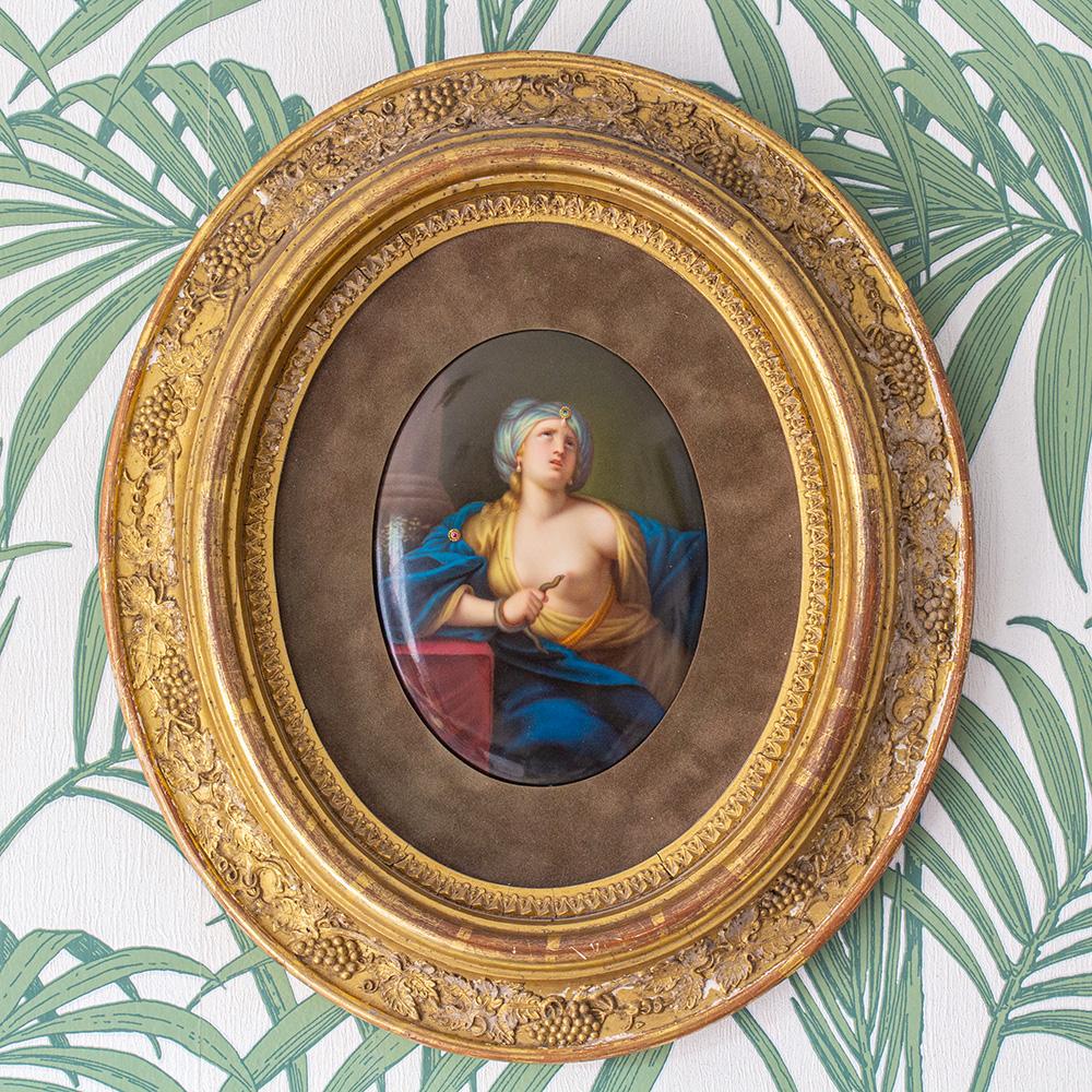 Fine Berlin KPM plaque circa 1870. The plaque of convex form painted with a portrait of The Death of Cleopatra. Cleopatra is painted with flaxen hair gathered beneath a turban wearing draped loose robes gazing into heaven bearing an asp to her
