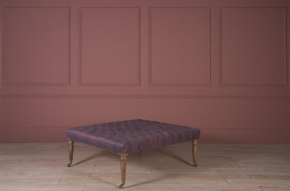Part of our Contemporary Created collection - A timelessly elegant, large upholstered and deep-buttoned ottoman, with classic turned legs and castors. 

We build our Loxford Deep-Buttoned ottoman up from a hardwood beech frame, using only