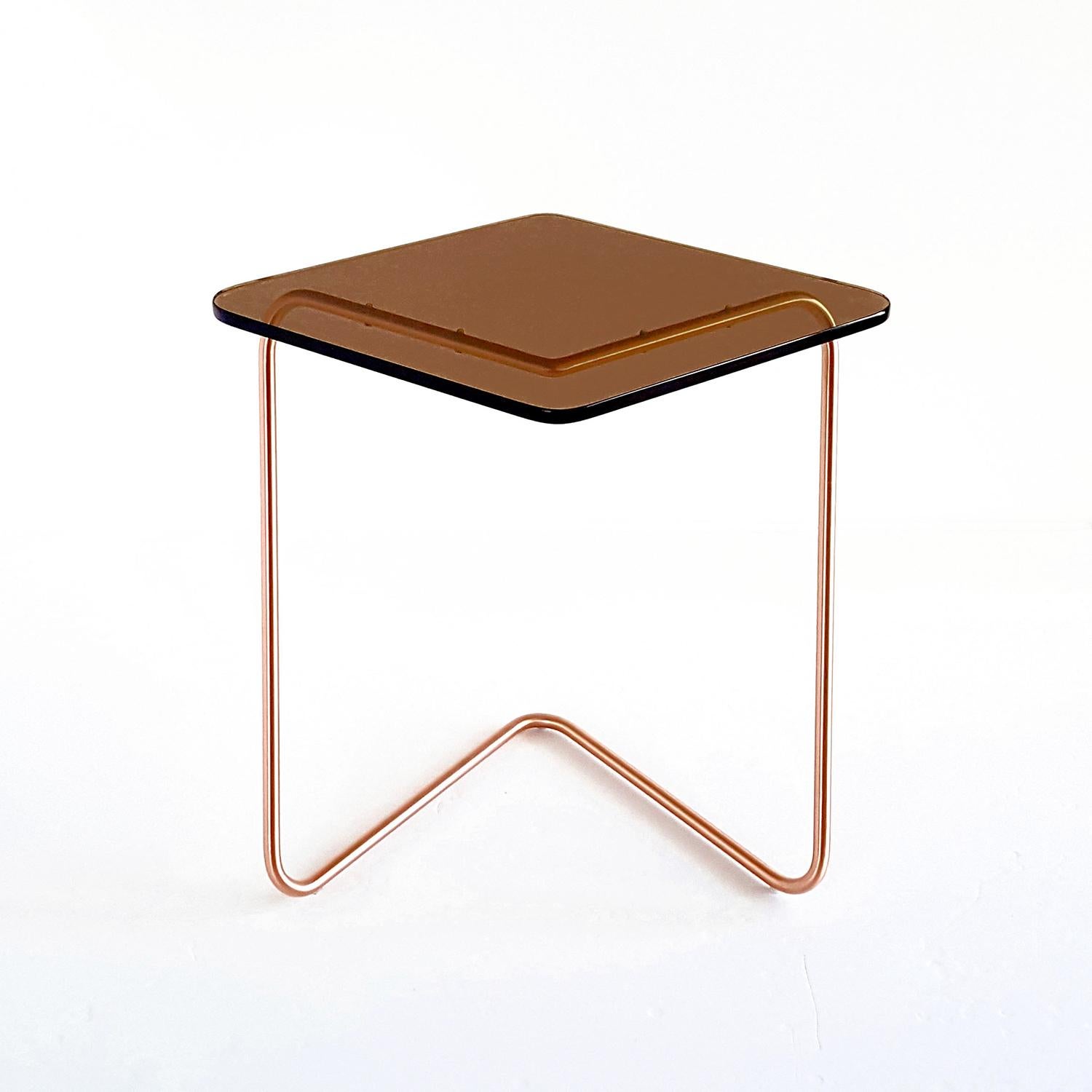 The Diamond side table by Rita Kettaneh 
Dimensions: The base: brushed stainless steel plated with copper
 optionally plated with copper or brass
 The top: acrylic
Materials: H 42 x W 45 x D 34.5 cm
Weight: 2.65 Kg

Colors and Finishes: