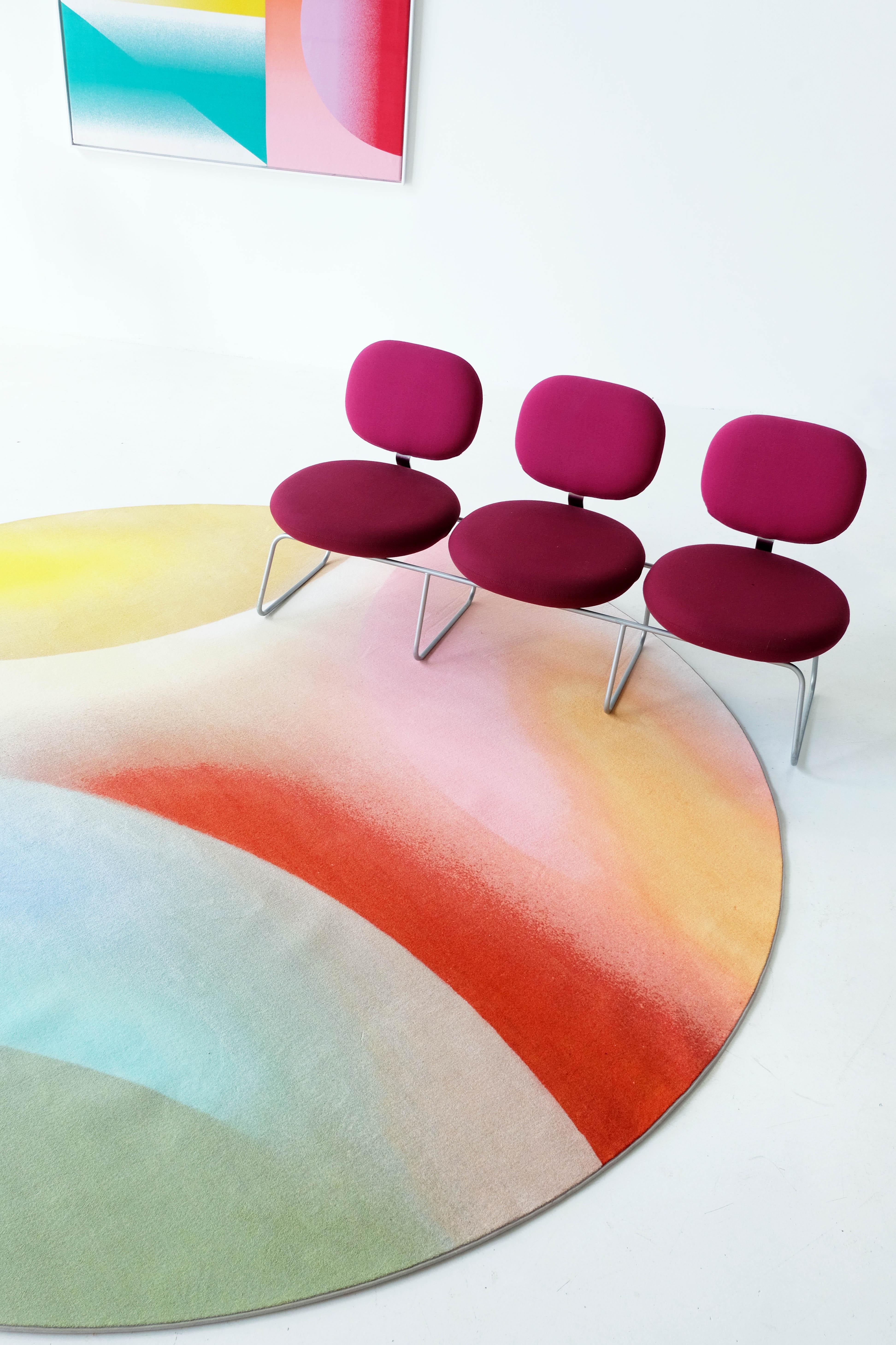 A round carpet featuring vibrant hues inspired by the unique color palettes I encountered in the Atacama Dessert in Chili. I hand-sprayed the entire artwork, combining soft gradients with bold lines in halve circles, creating intriguing new worlds.