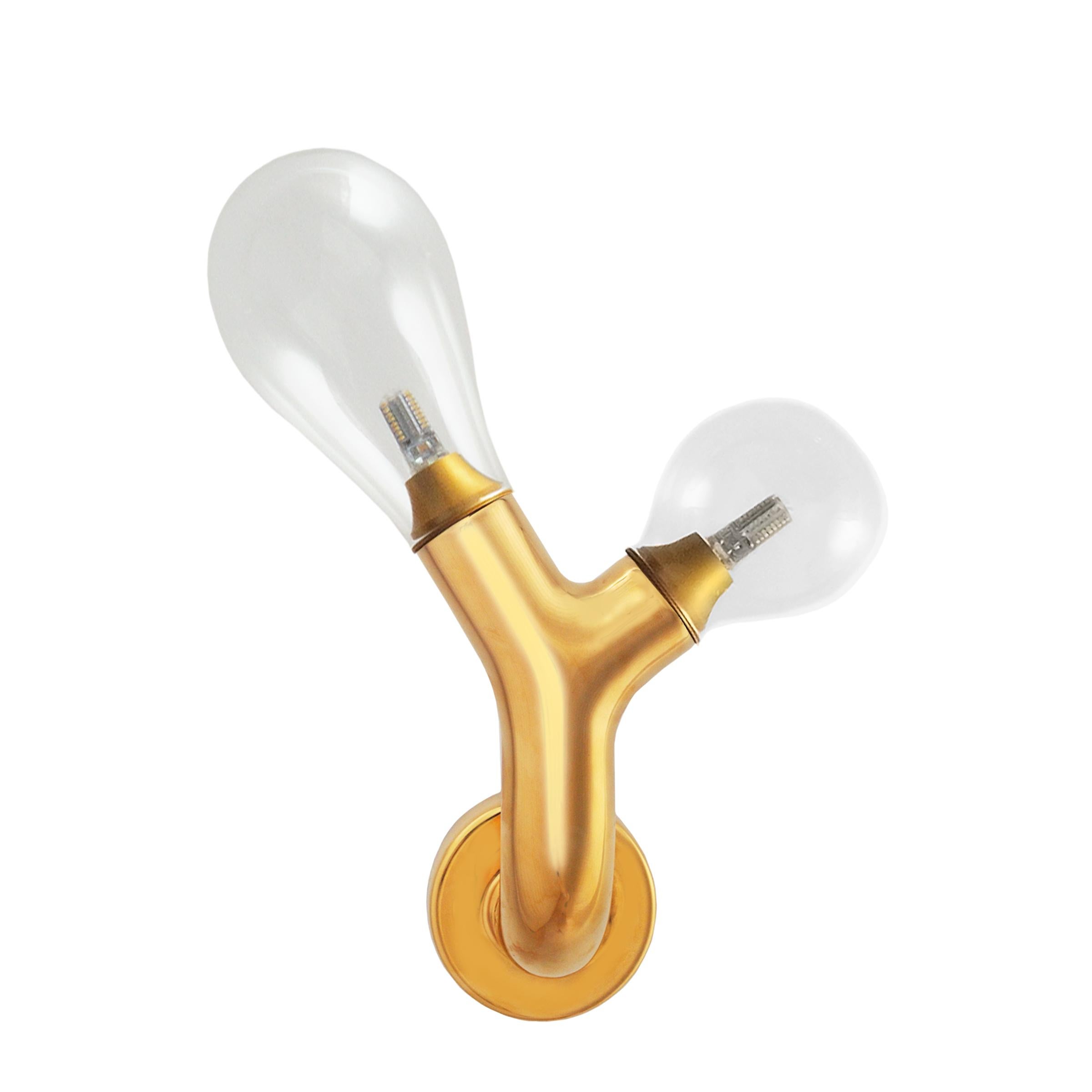 The Double Bulb Gold Plated Murano Glass Wall Light by Matteo Cibic is a Classic wall light with two bulbs.

One summer, Matteo Cibic along with the founding duo of Scarlet Splendour, travelled through Italy. During their days spent within the