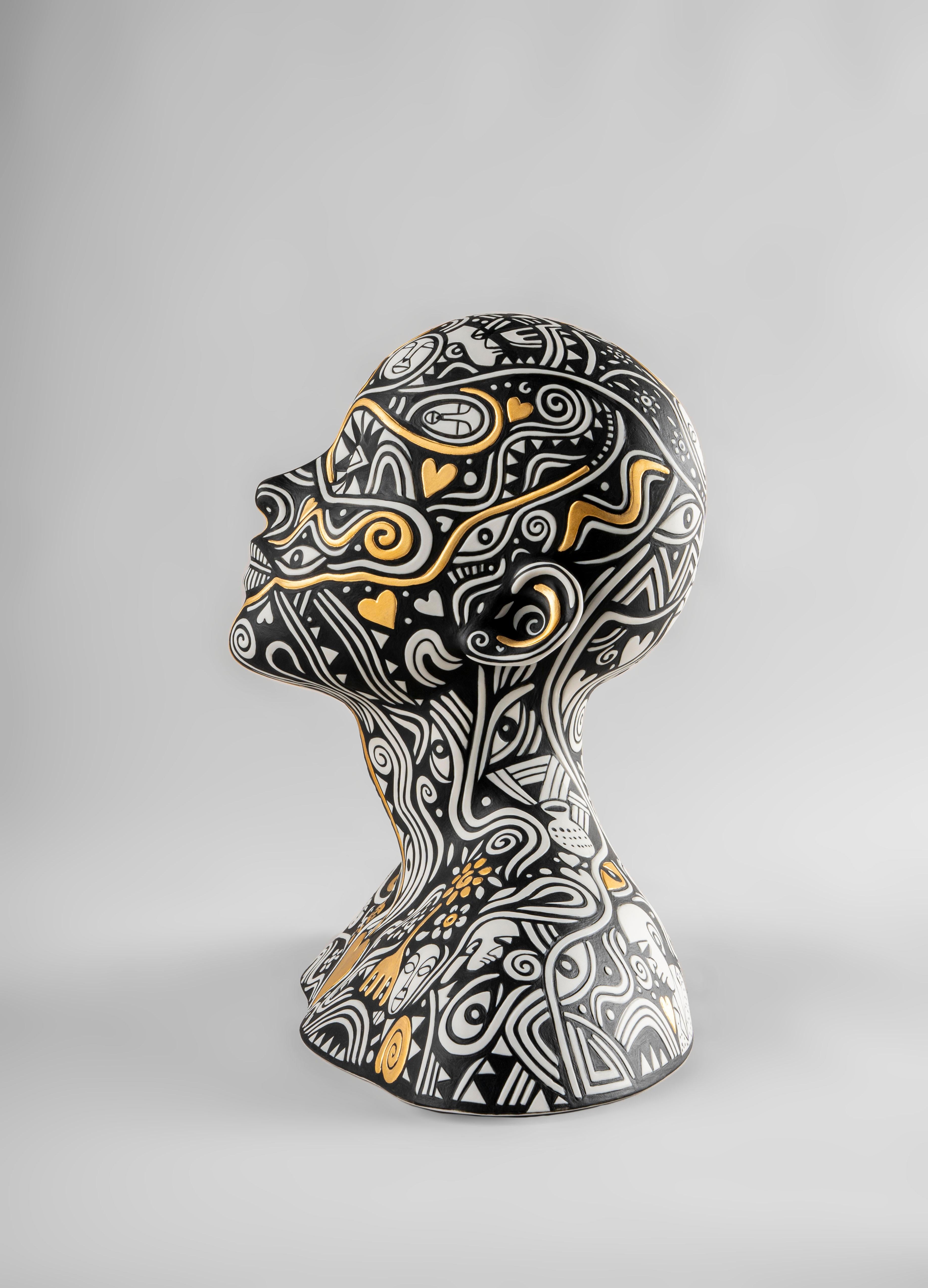 Porcelain sculpture made in collaboration with the Nigerian artist Laolu. A conceptual creation with the personal stamp of a committed artist. This porcelain sculpture decorated with a compelling combination of white, black and golden luster is the