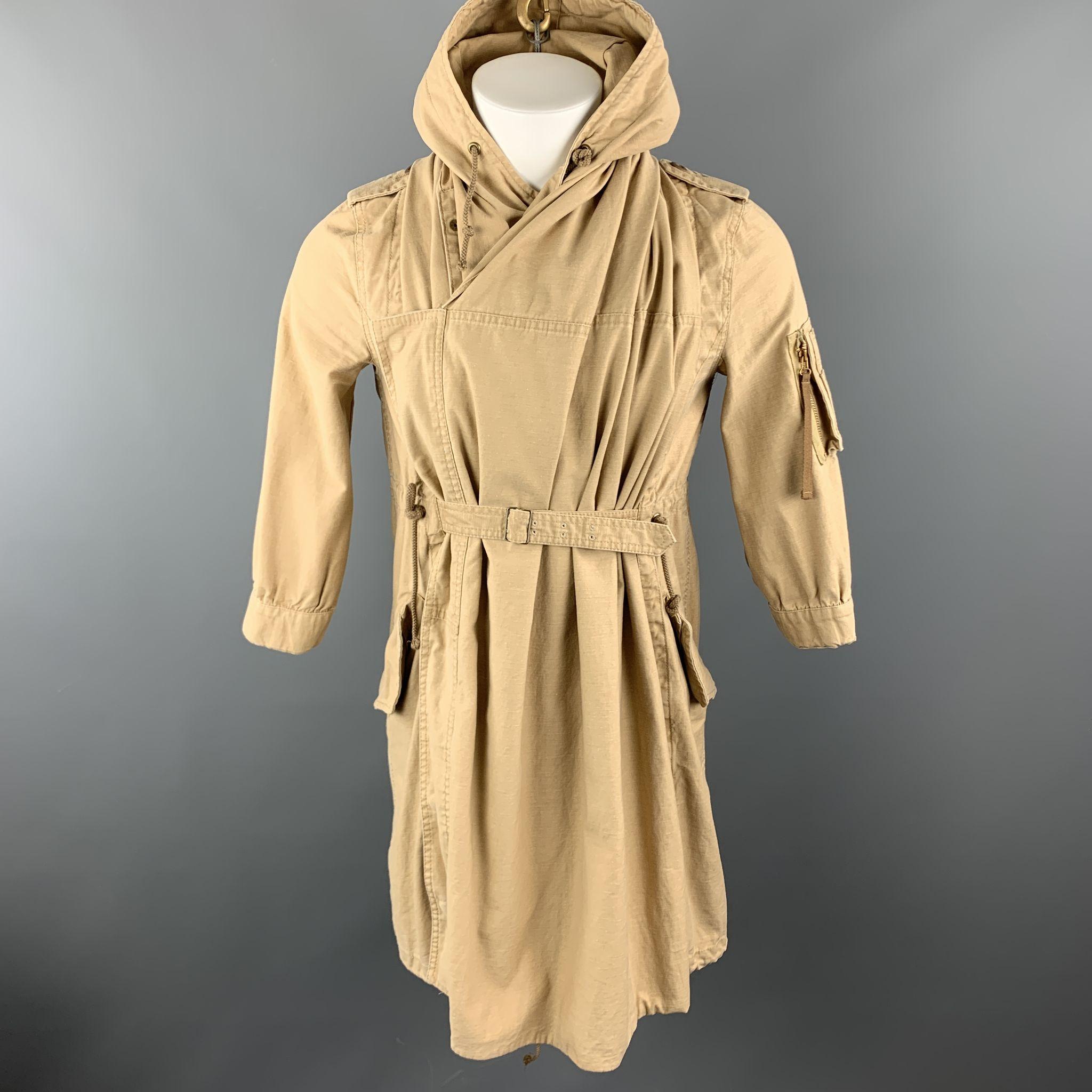 THE DRESS & CO. by HIDEAKI SAKAGUCHI Cape Jacket comes in a solid khaki cotton material, with a hood, epaullettes, a cape, cargo and flap pockets, drawstring, a belt, and buttoned cuffs. Made in japan. 

Excellent  Pre-Owned Condition.
Marked: