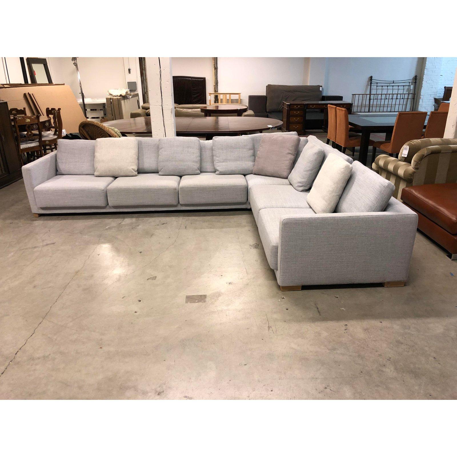 The drop in sectional by Bensen Inc. This design combines simplicity with a new method of furniture construction with design simplicity. The contemporary frame has a thin profile contrasted by large cushions, for timeless appeal. Tundra gray