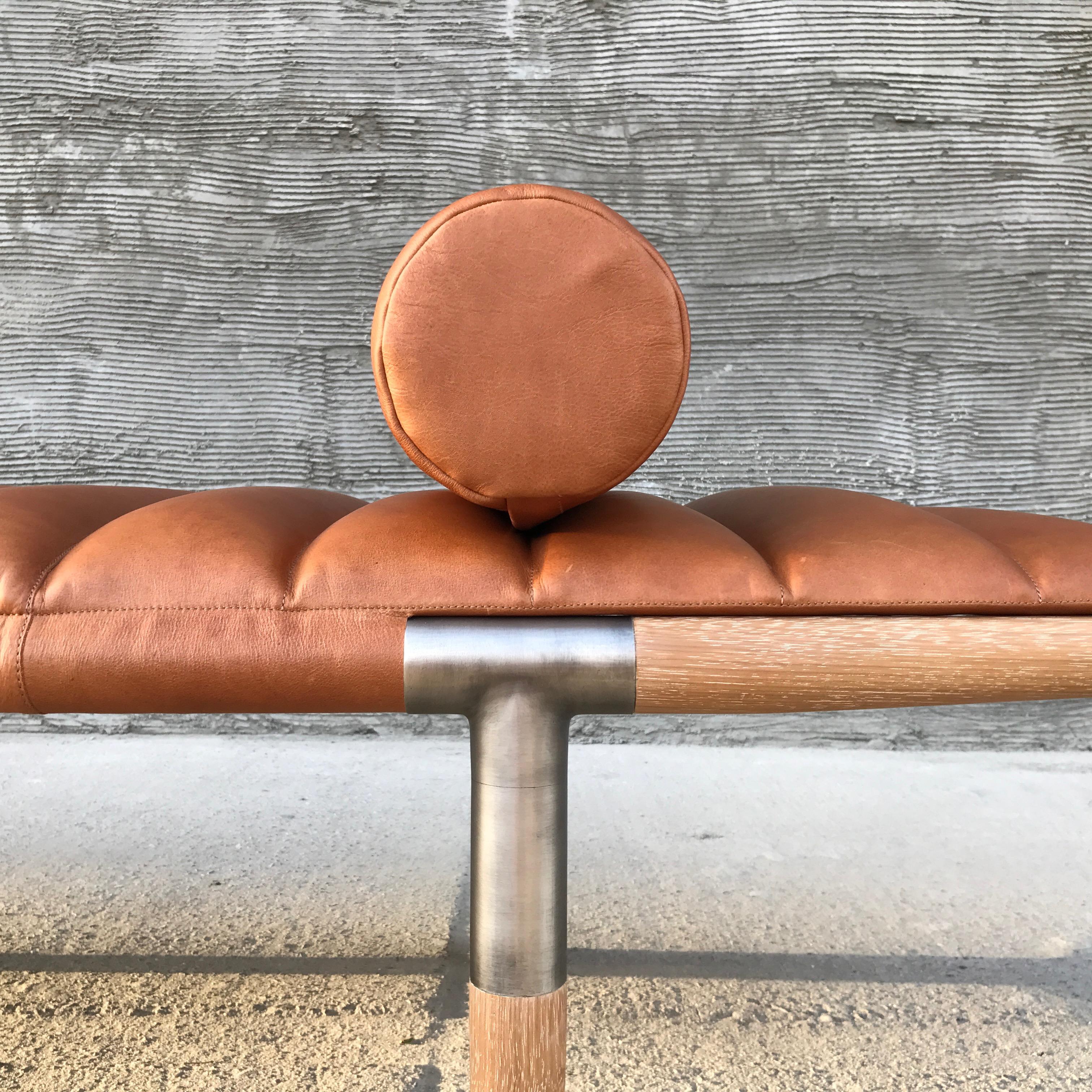 The EÆ daybed in Cognac leather with Cerused Iroko legs & burnished nickel frame.
“I wanted to create something better than Mies van der Rohe,” says designer Ben Erickson of Erickson Aesthetics about his EAE daybed, which bears a striking